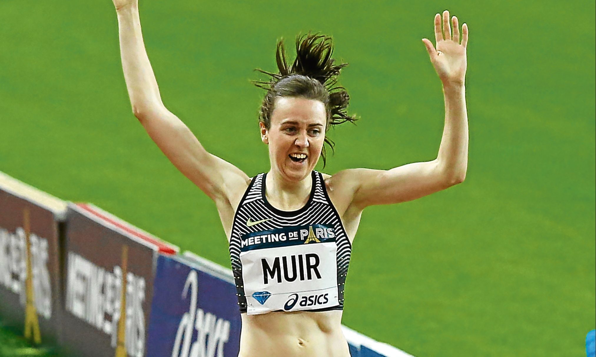 Laura Muir crosses the finish line to win the women's 1,500m event at the IAAF Diamond League athletics meeting at Stade de France stadium.