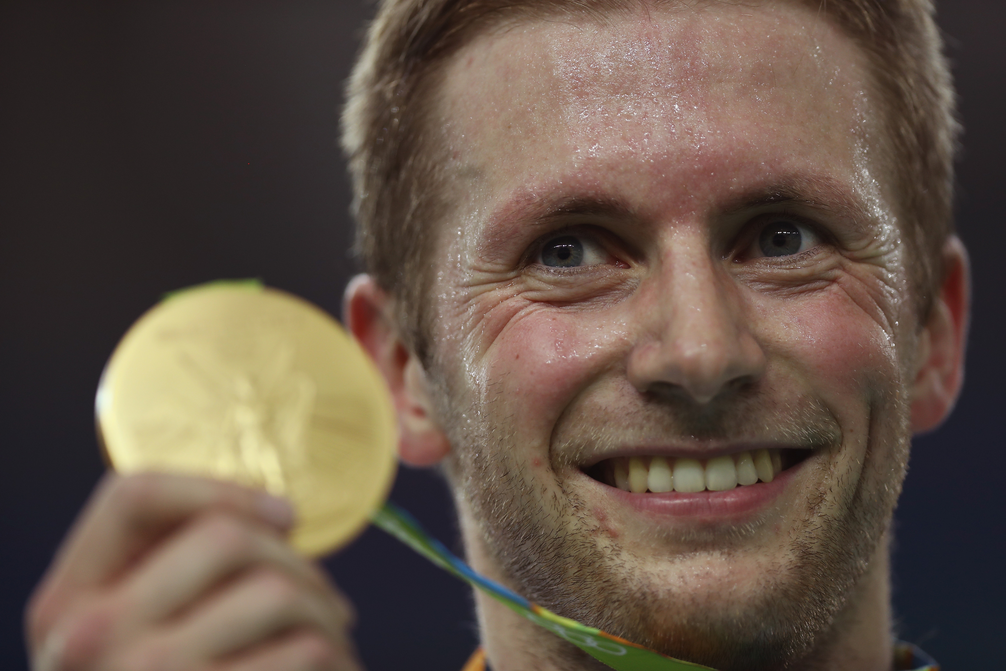 Jason Kenny with one of the British cycling team's many medals.