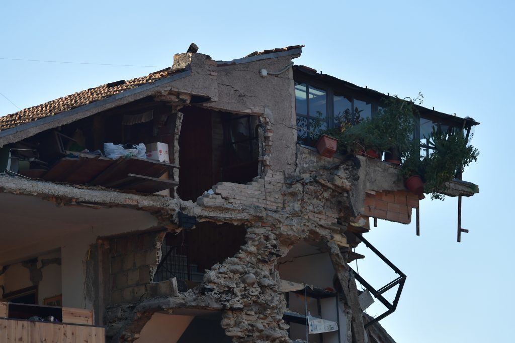 A building is severely damaged in Amatrice.