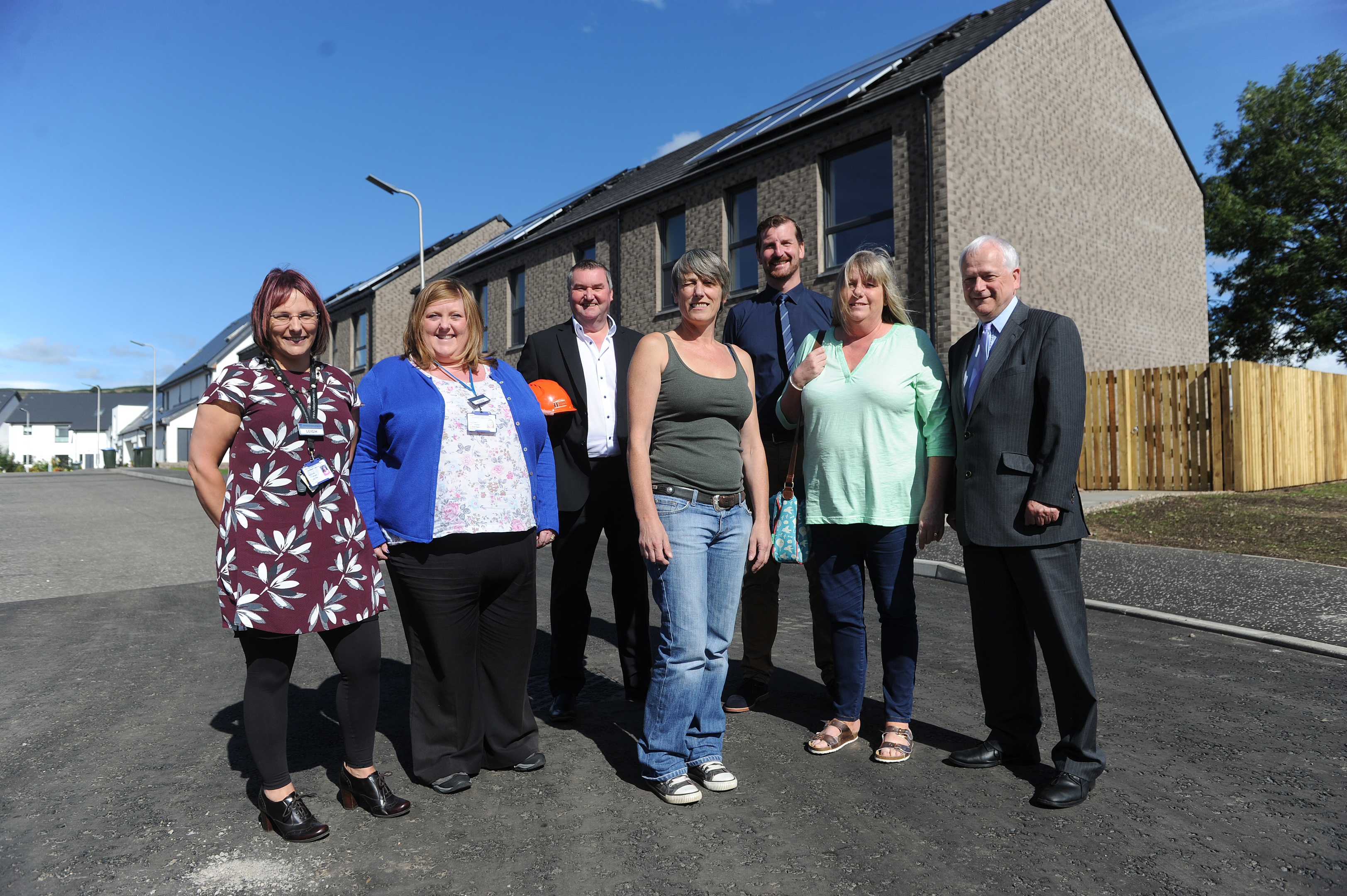 In front of the new build housing, l to r - Leigh Thow and Suzie Rogers (Perth and Kinross Housing Officers), Scott Hadden ((Chairman of Hadden Construction), Nicola Davidson (new tenant), Councillor Dave Doogan (Perth and Kinross Council Convenor of the Housinhg Committee), Amanda Blakeman (Chair of Alyth Community Council) and Councillor Ian Miller (Perth and Kinross Council Leader), Springbank Road, Alyth.
