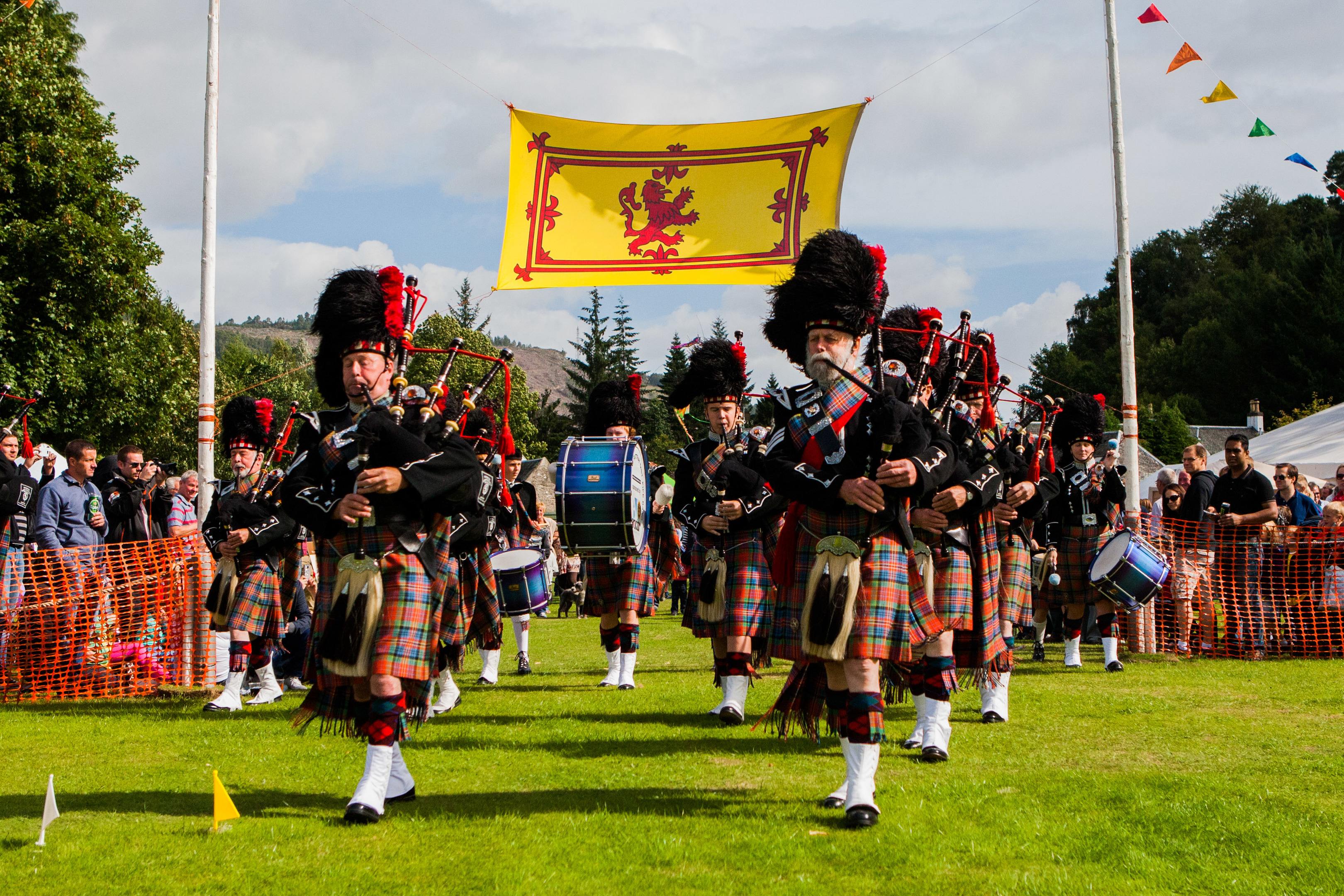 Blairgowrie & Rattray District Pipe Band parading into the main arena at the Recreation Park.