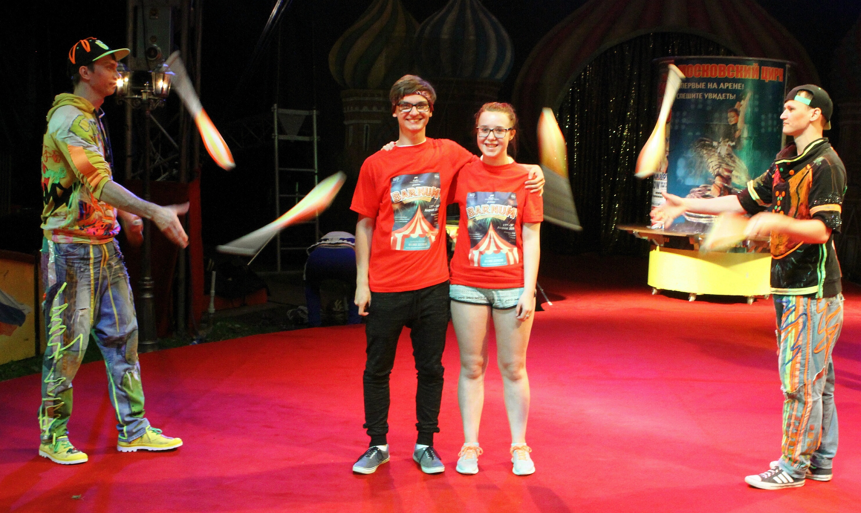 DSMT performers Marceli Guziewicz and Hannah Wright get a close up look at the Barrel Jugglers Ilya Malyshkov, left, and Linar Salimov.