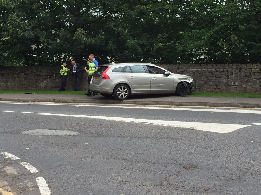 The van hit a Volvo, spinning it onto a grass verge