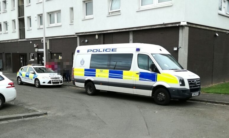 Police presence at Dundee's Adamson Court during drug raids.