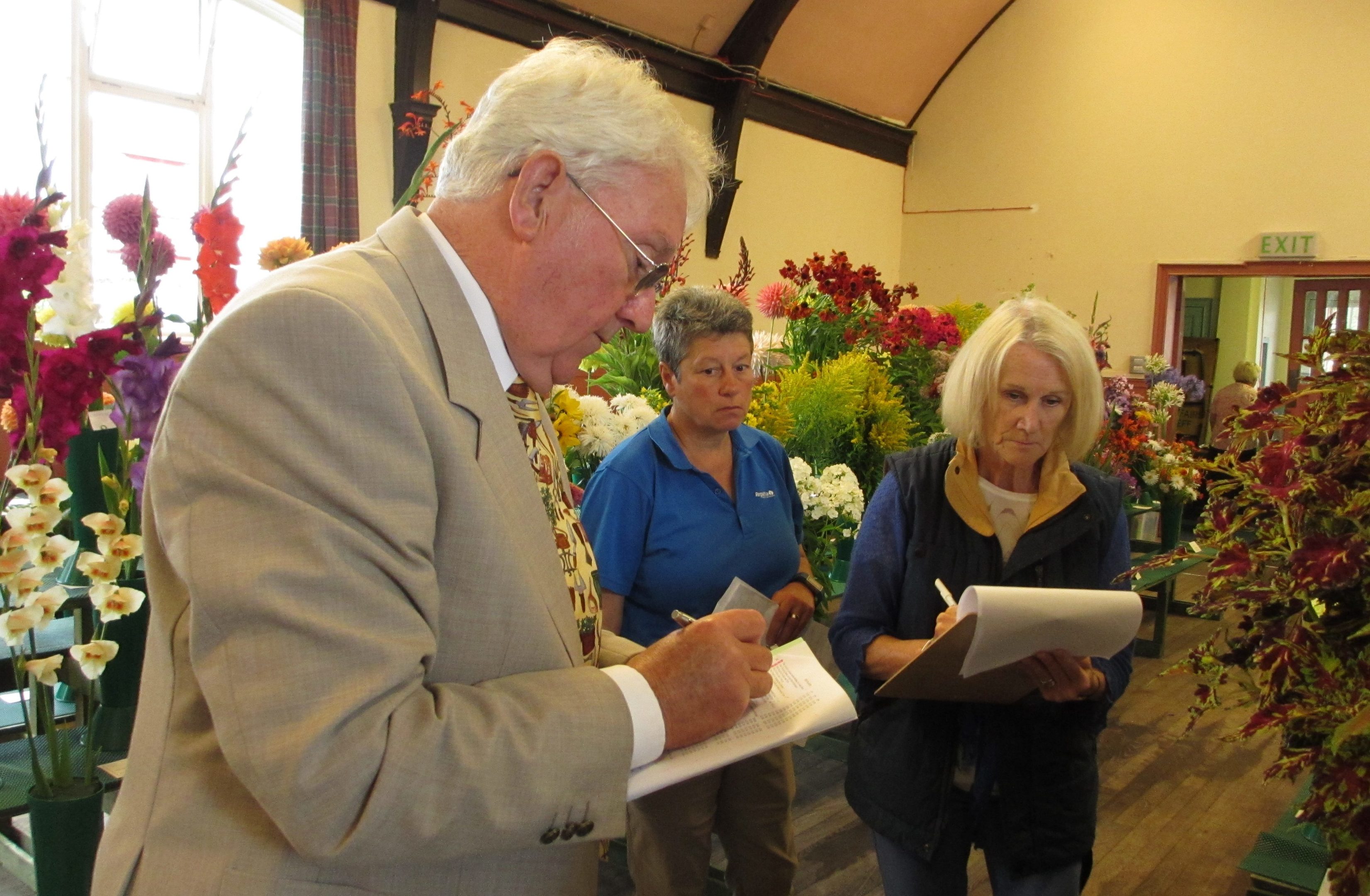 Judges oversee the entries at the RHS flower show.