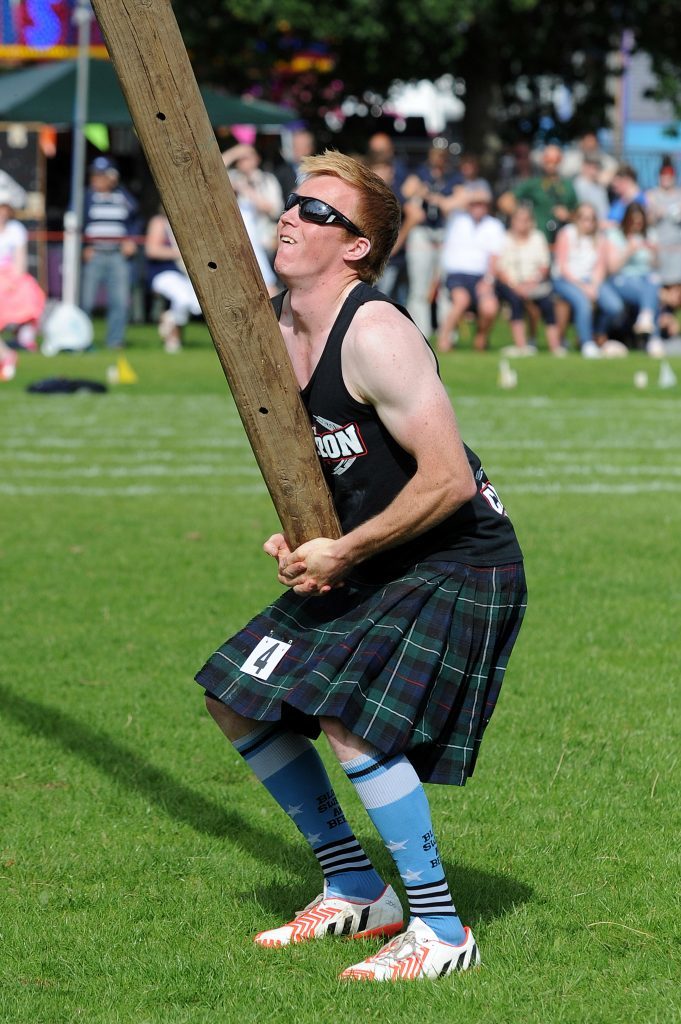 Heavy competitor David Colthart in the caber competition