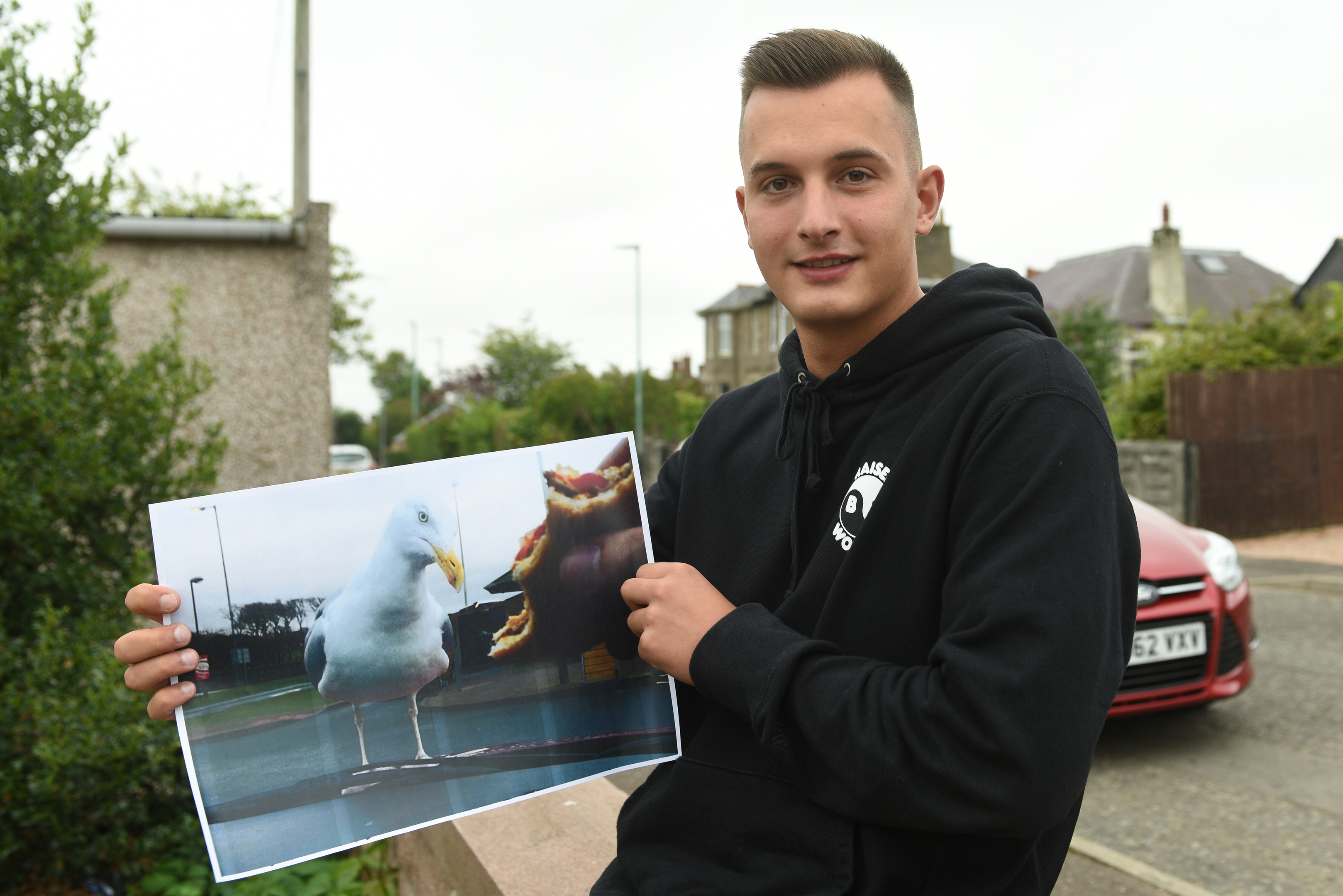 Krystian Mlynarski with a copy of his winning picture.