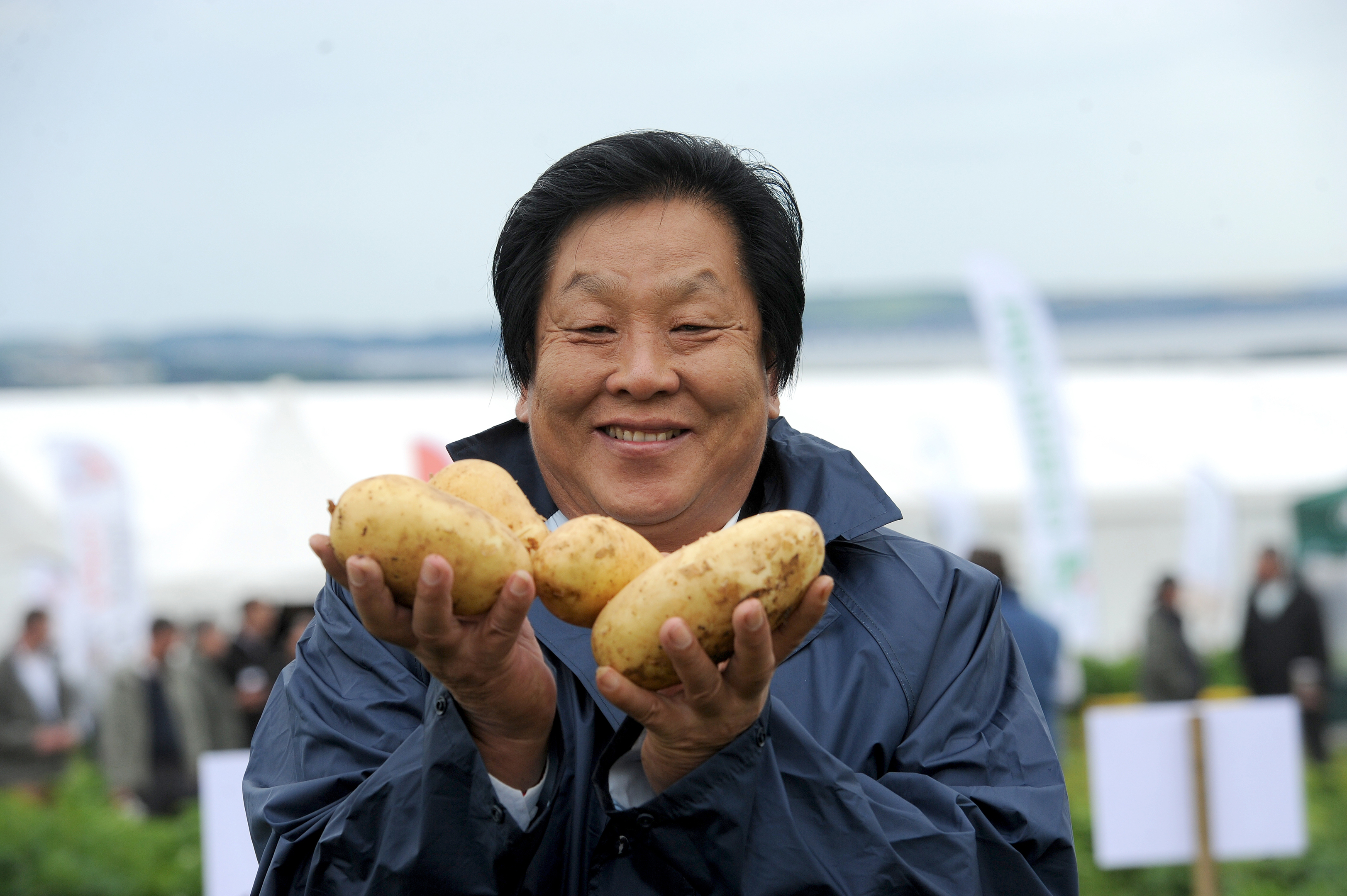 Mr Liang's company grows potatoes on 100,000 hectares in Inner Mongolia
