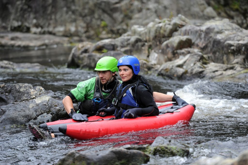 Splash Rafting guide Donas Jegat tells Gayle what to do.