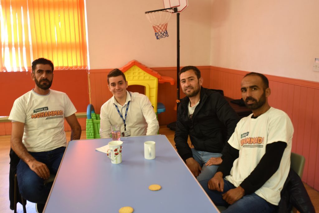 Courier reporter Jamie Milligan with (from left) Tayseer Al-Balkhi, Thamer Humsi and Imaad Zakariya.