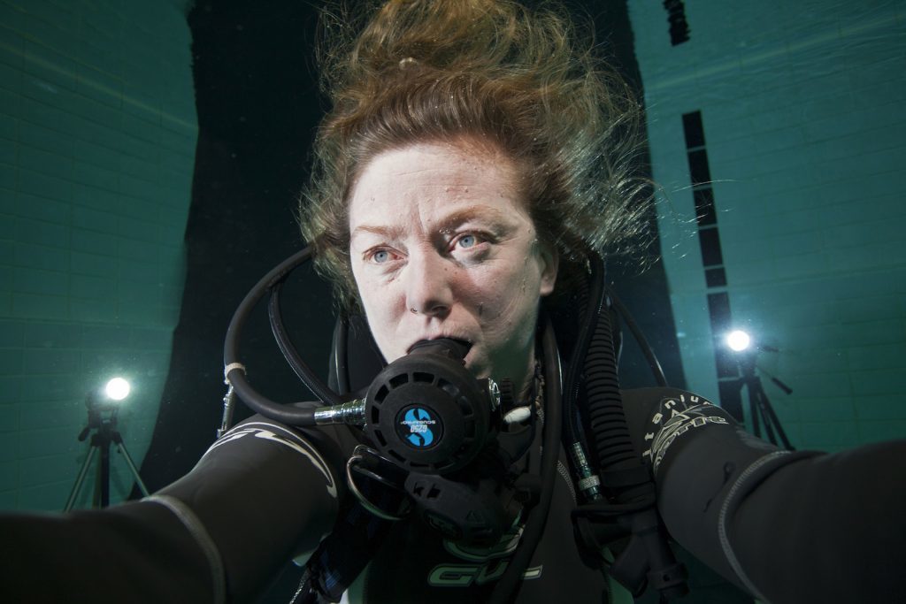 Film maker Lindsay Brown testing the light underwater