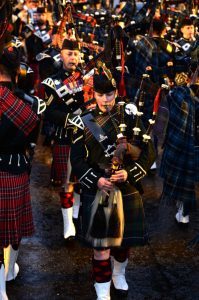 Lance Bombardier Megan Beveridge as the lone piper at the Royal Edinburgh Military Tattoo Photo Caption:- Megan high in the stands at the Royal Edinburgh Military Tattoo. Magic Megan makes musical history at the Royal Edinburgh Military Tattoo! Scottish Soldier, Lance Bombardier Megan Beveridge made piping history when she became the first female to pass the very exacting Army Pipe Majors course. Now she has made history again at the Royal Edinburgh Military Tattoo as the first Regular Army female piper to take on the prestigious role of the Lone Piper at the Scottish capitals annual military music extravaganza. Fifer Megan, who hails from Burntisland, is also the youngest to have attained the Pipe Majors qualification, at the age of 21. She was selected for the honour of being the Lone Piper by the Armys Director of Army Bagpipe Music and Highland Drumming, Major Steven Small, who has carried out the task many times himself as a Piper for The Black Watch  now known as The 3rd Battalion The Royal Regiment of Scotland. She was the sole focus of the 8,800-strong audience, as she was lit up on the Castle Ramparts, after the massed Pipes and Drums and Military Bands on the Esplanade fell silent and she played the famous lament Sleep Dearie Sleep at the end of the finale. This is cited by many Tattoo-goers as the most moving and uplifting part of the show and is certainly one of the greatest honours and achievements that any Army Piper can hope to achieve. Almost all professional Pipers and Drummers in the Regular Army are from Infantry or Royal Armoured Corps units. Megan is a member of 19th Regiment Royal Artillery, The Scottish Gunners, who are unusual in the fact that they are not an Infantry or a Royal Armoured Corps Regiment, but still have a Pipes and Drums on their strength. Women can serve in Artillery Regiments in the Army, so Megan chose The Scottish Gunners as her Regiment to further improve her prospects as a Piper. When she isnt pipin