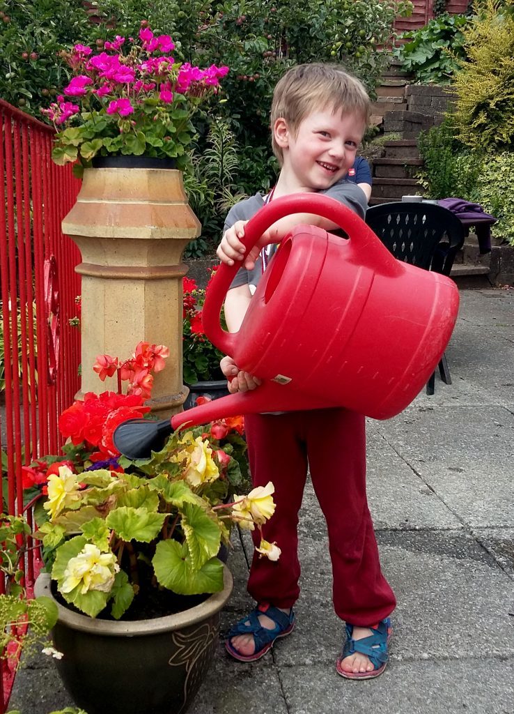 Luke watering the flowers