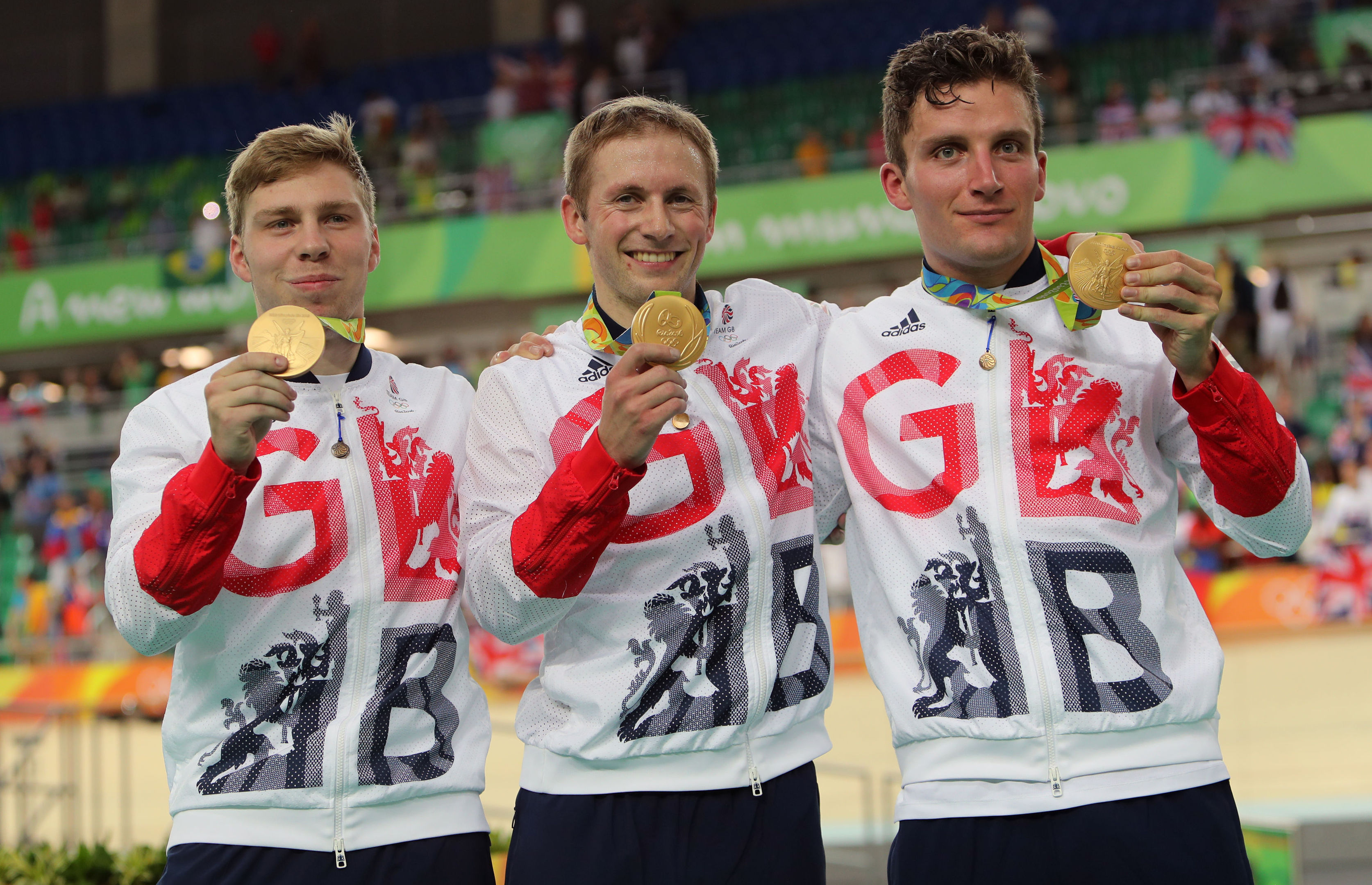 Great Britain's Philip Hindes, Jason Kenny and Callum Skinner with their gold medals following the men's team sprint final.