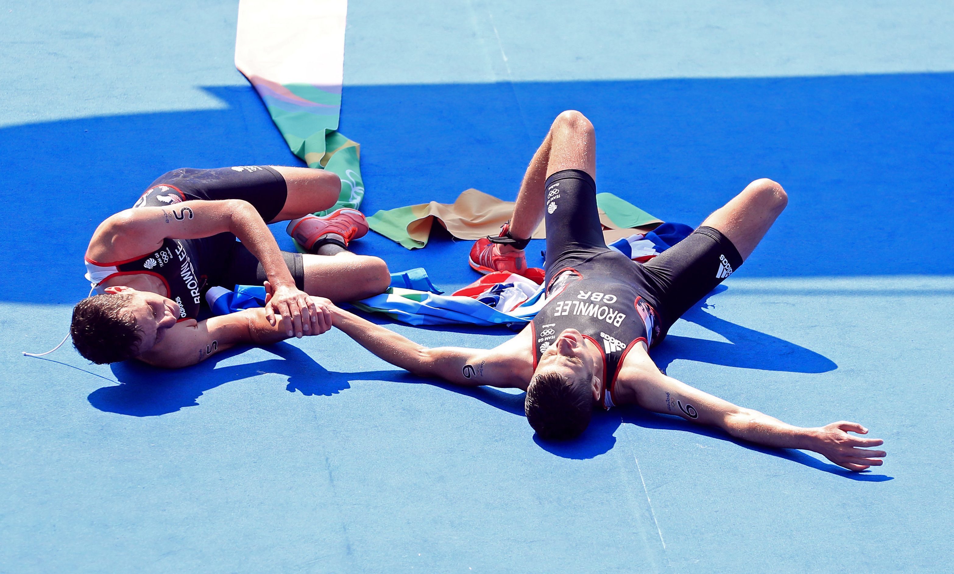 Alistair Brownlee (left) and brother Jonny embrace after winning gold and silver in the men's triathlon.