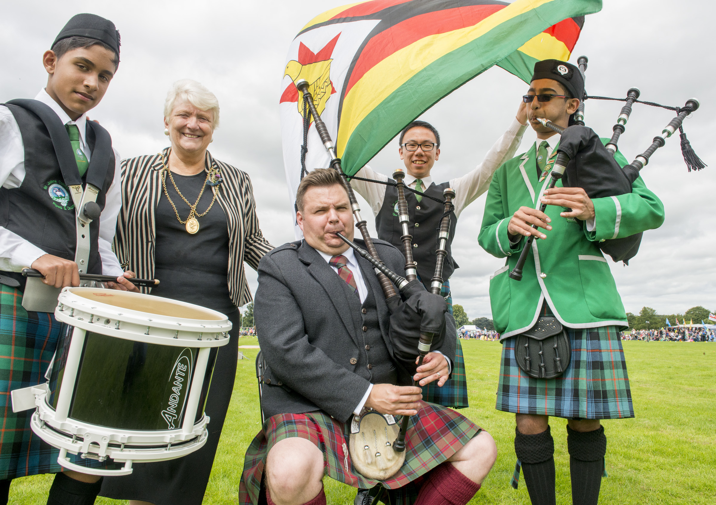 Chieftain Stuart Cassells  pictured with Perth Provost Liz Grant and some of the members of the St John’s College pipe band from Zimbabwe.