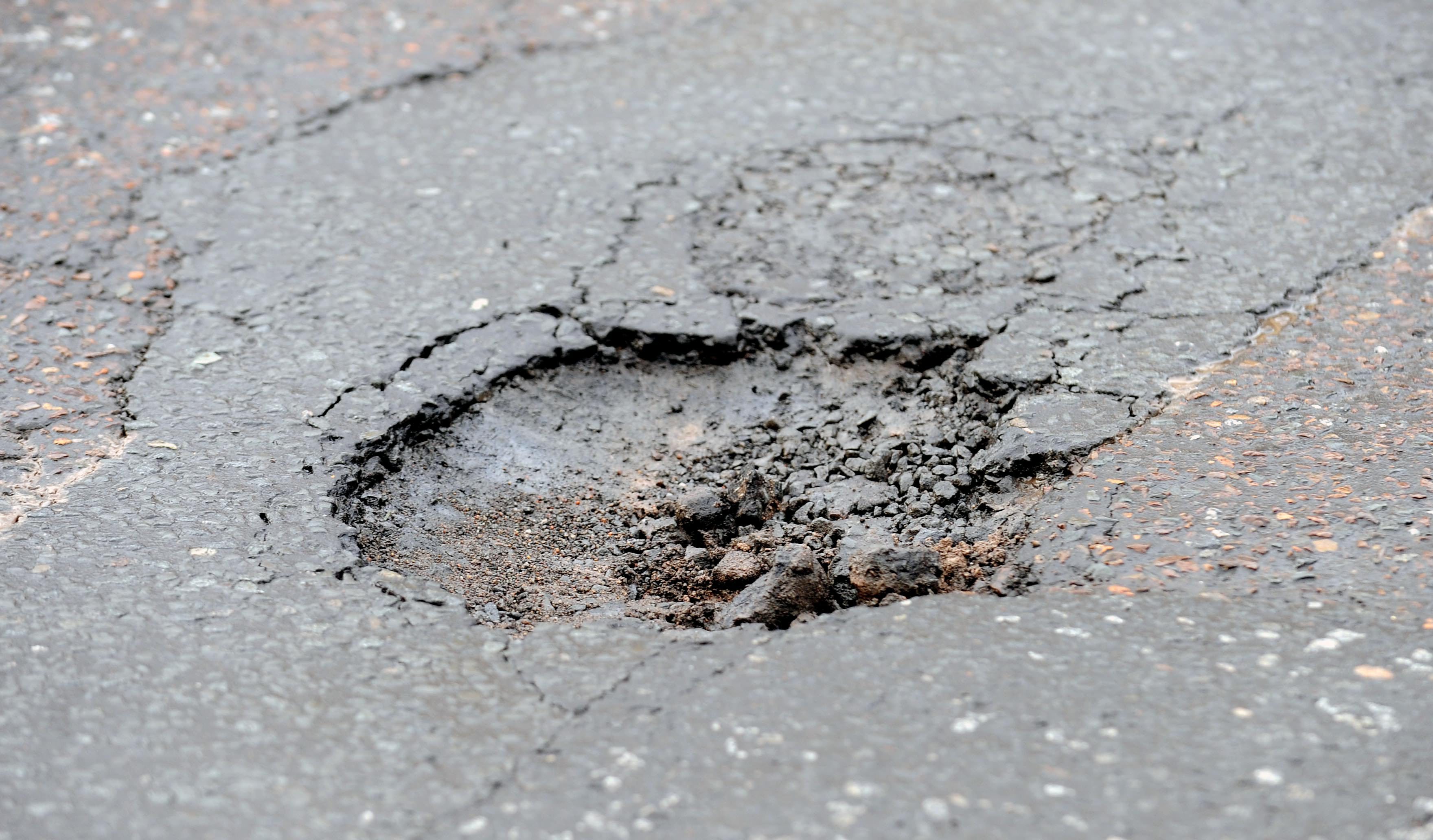 Council spending on roads has gone down by one-fifth in seven years.