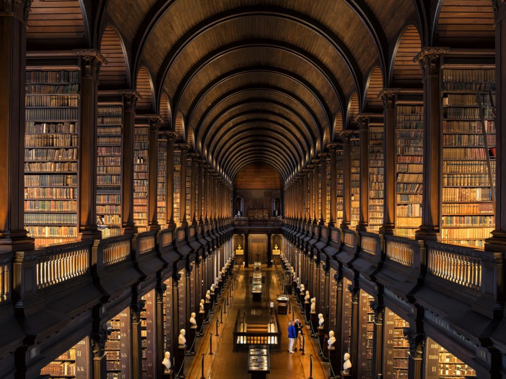 Couple visiting the Long Room at Trinity College, Dublin.