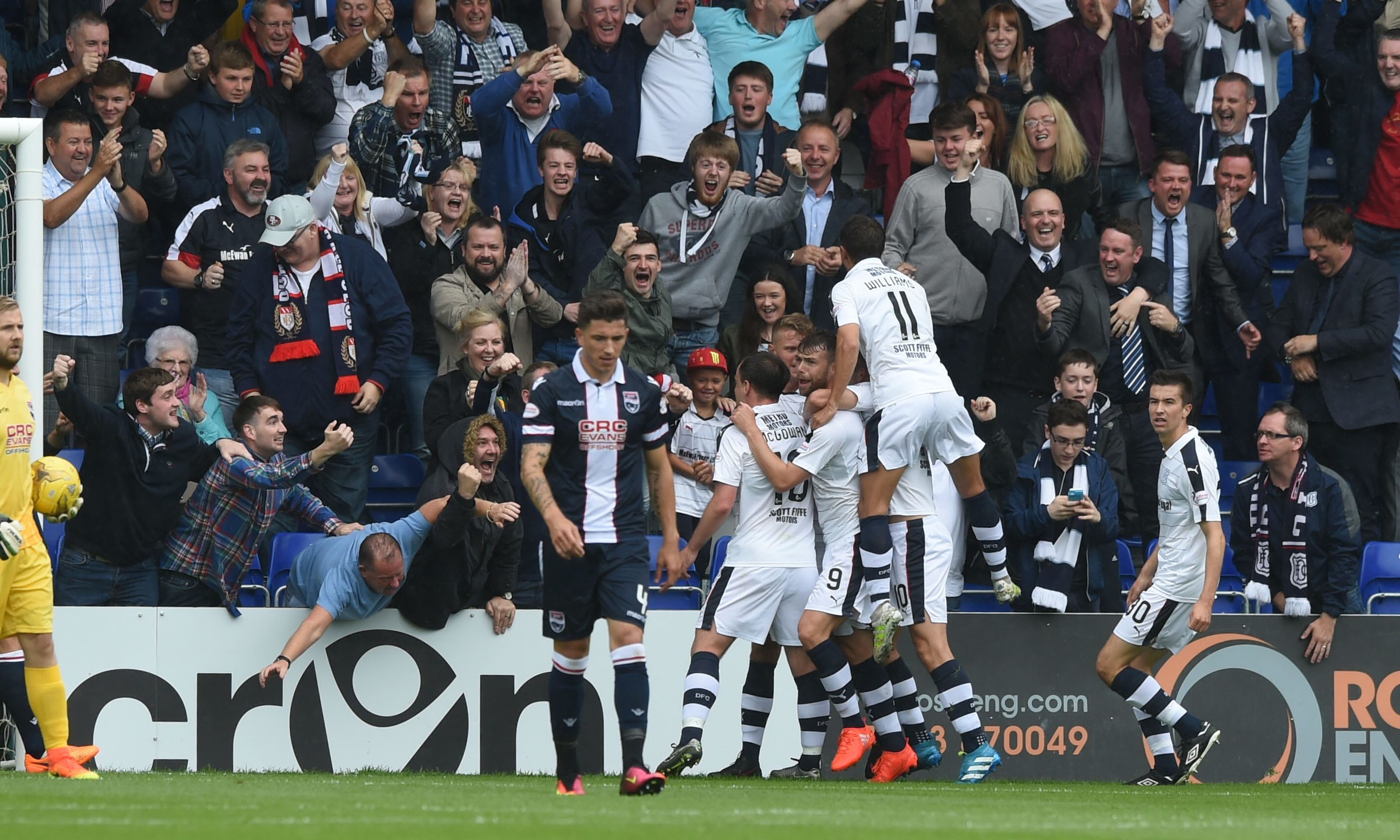 The Dundee players celebrate the Rory Loy opener.