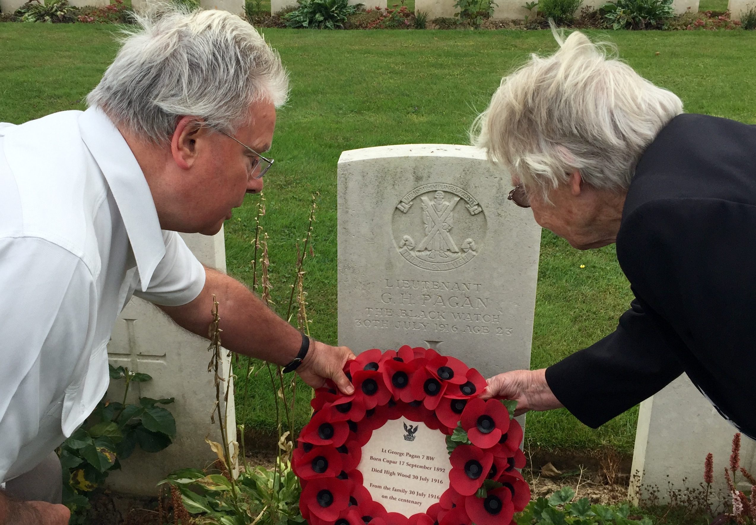 Bill Pagan and Judy Workman lay a wreath on their uncle George Pagans grave neat Thiepval in north France