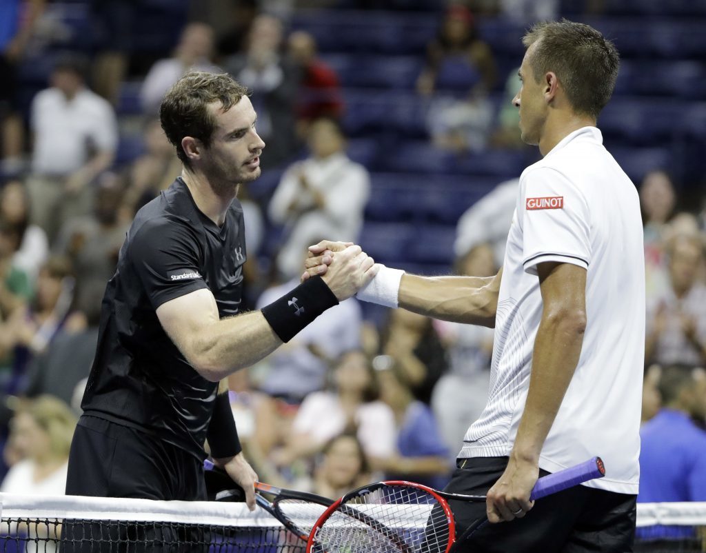 Andy Murray is congratulated by Lukas Rosol.