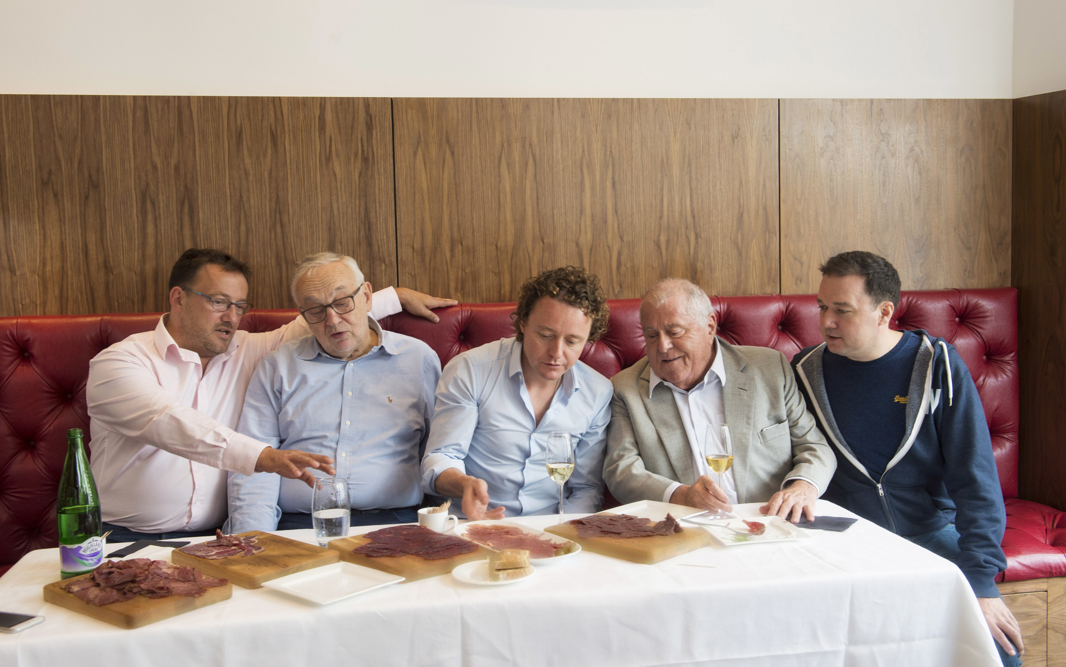 Distinguished chefs feasting on hand-made Wagyu charcuterie. (L-R) Fred Berkmiller of L'escargot Bleu and Blanc , Edinburgh, Pierre Koffman of Koffman's at the Berkeley in Knightsbridge, Tom Kitchin of The Kitchin in Leith, legendary chef Albert Roux and Shaun Whatling Executive Chef of Koffman's in Knightsbridge. The new high-street store is the brainchild of the husband and wife team, Mohsin Altajir and Martine Chapman, behind Highland Wagyu.