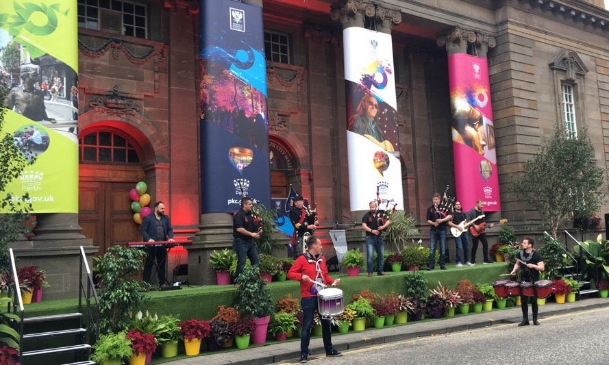 The Red Hot Chilli Pipers performing outside the City Hall at the City of Culture bid launch.