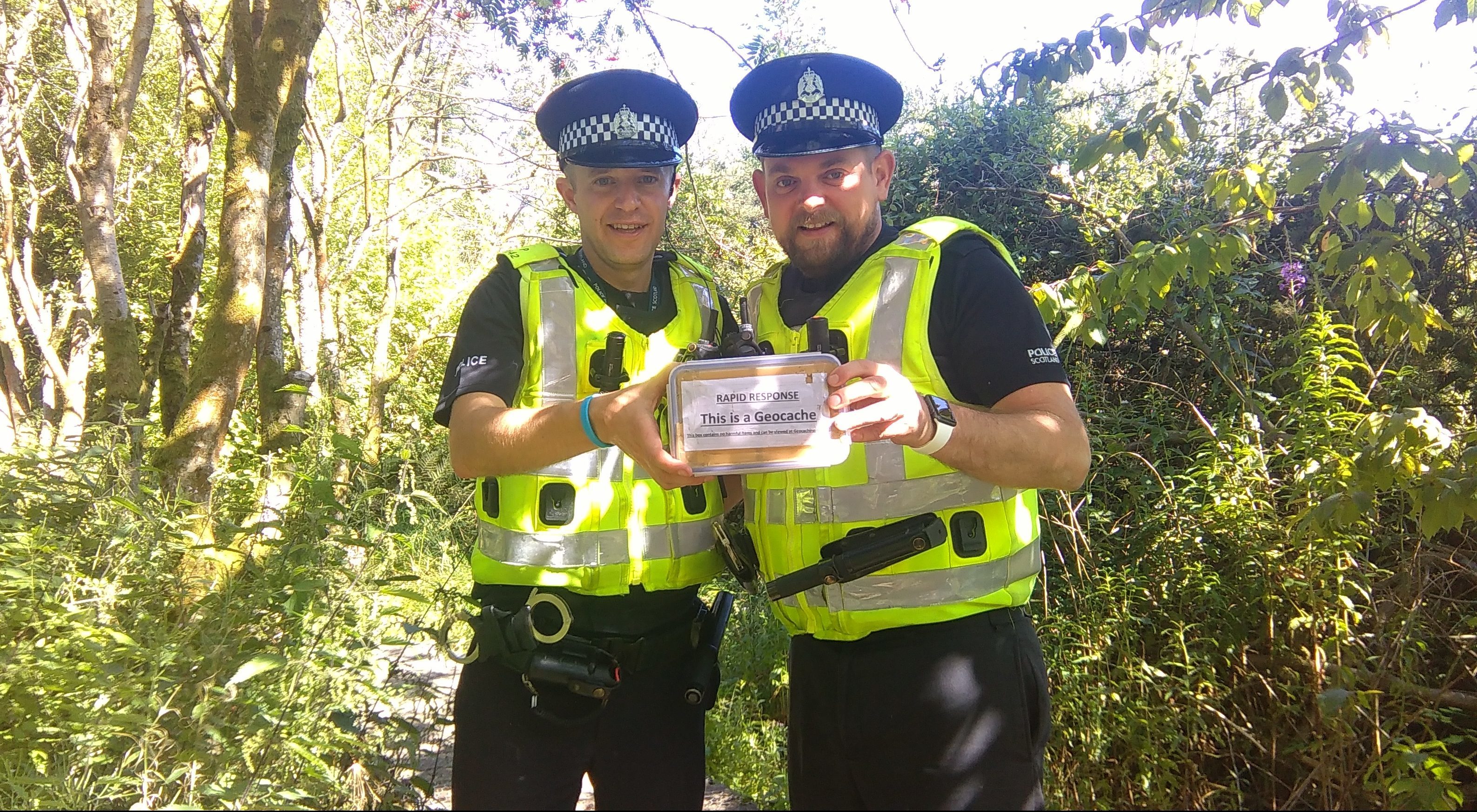PC Barry Smith and PC Gary Chrystal placing one of the geocaches