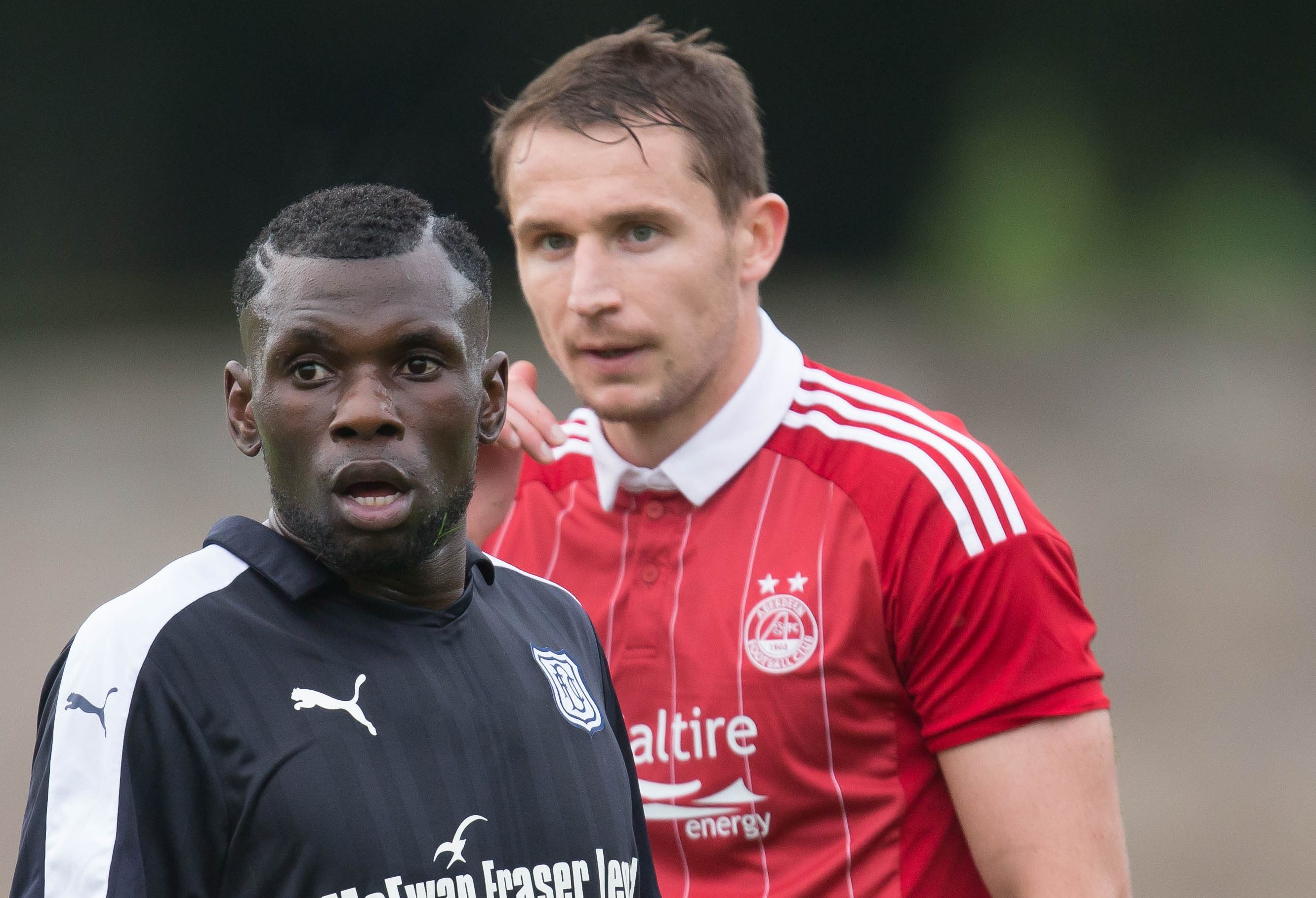 Dundee trialist Lynel Kitambala and Aberdeen's Callum Morris.