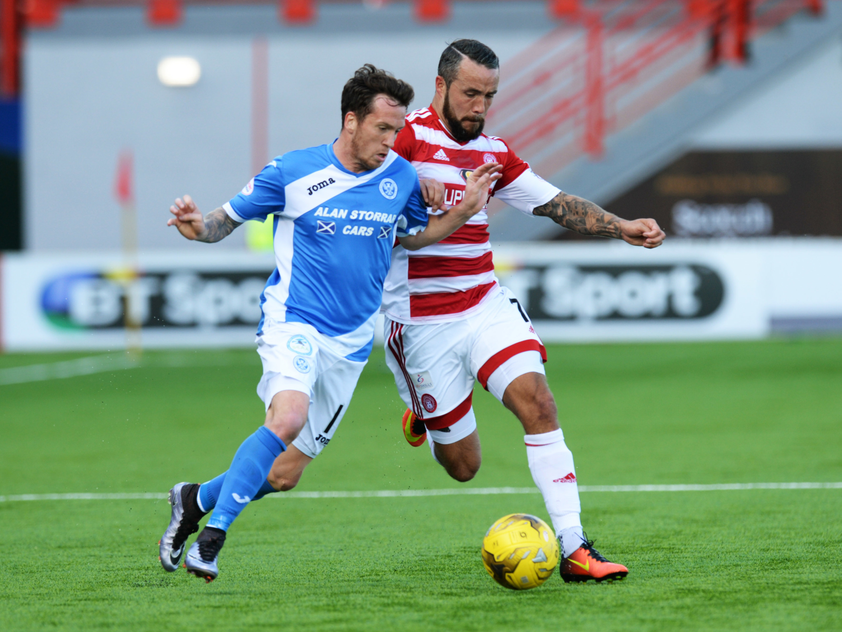 St Johnstone's Danny Swanson and Hamilton's Dougie Imrie battle for the ball.