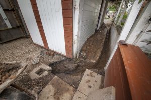 The elderly couple were forced to rip up their garden to put in French drains.
