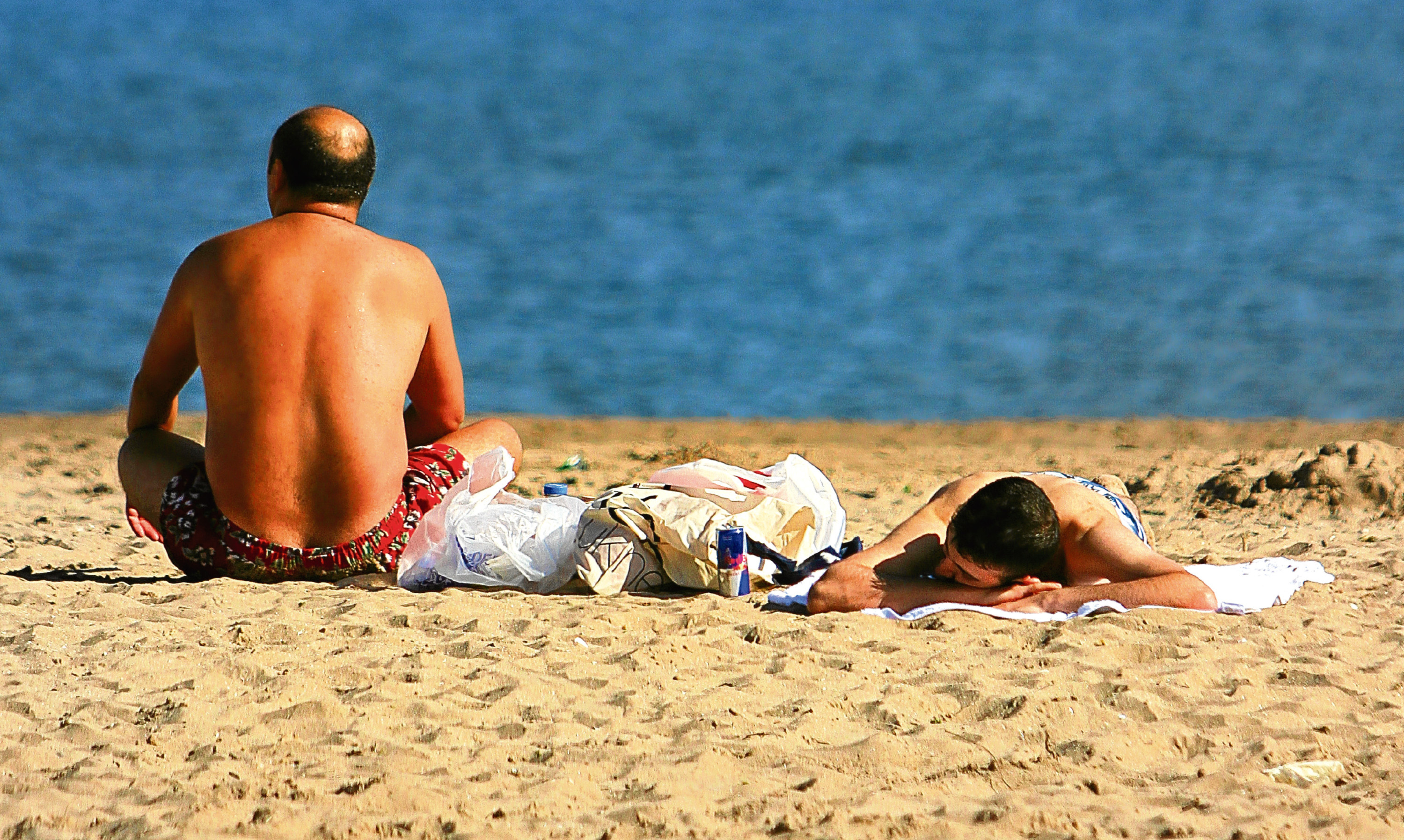 Sunbathers at Broughty Ferry beach make the most of what is often a very limited Scottish summer.