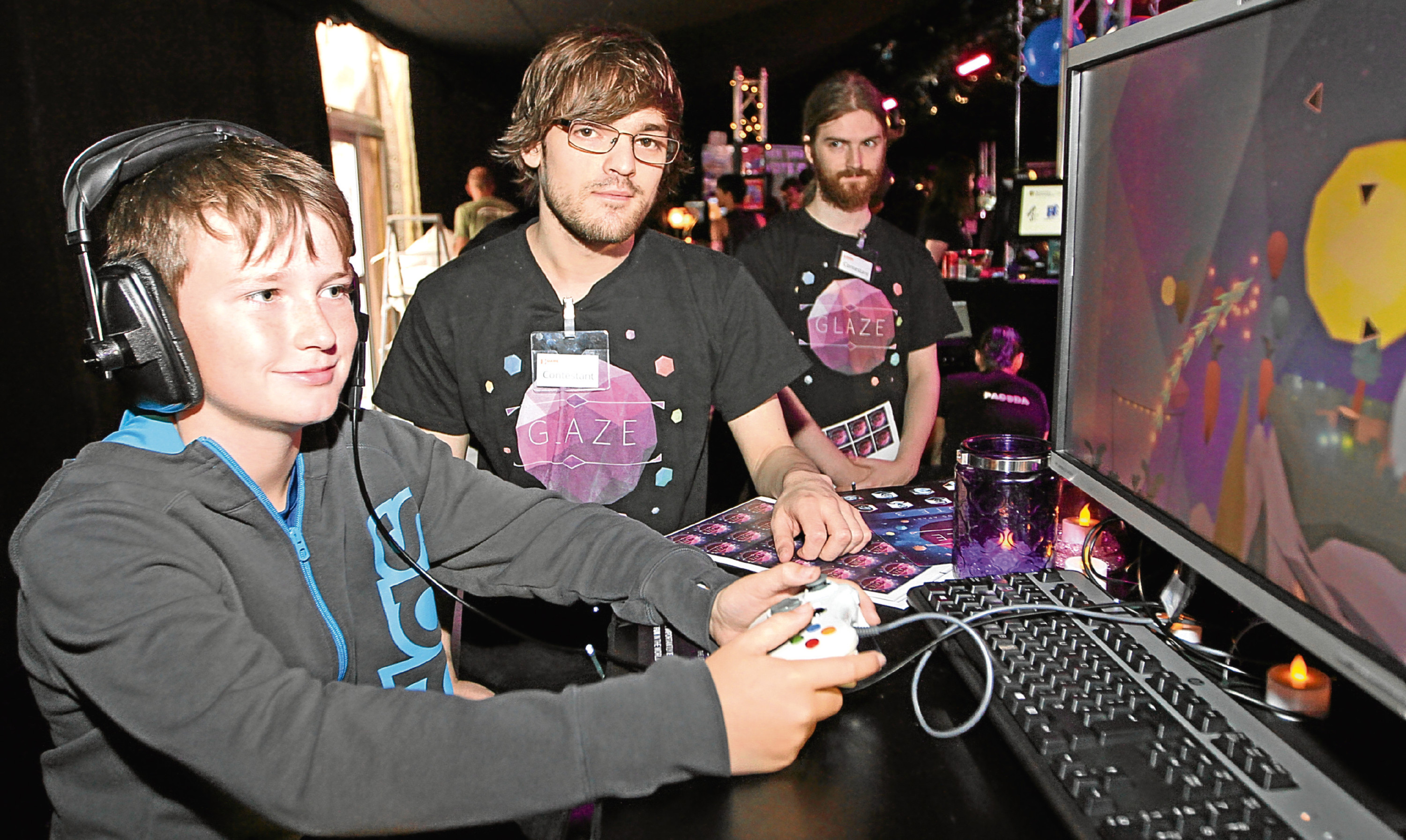 A young video games enthusiast showing off his skills in Dundee.