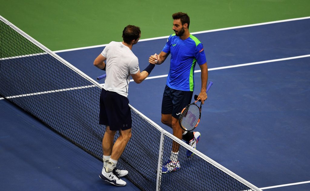 Andy Murray shakes hands with Marcel Granollers.
