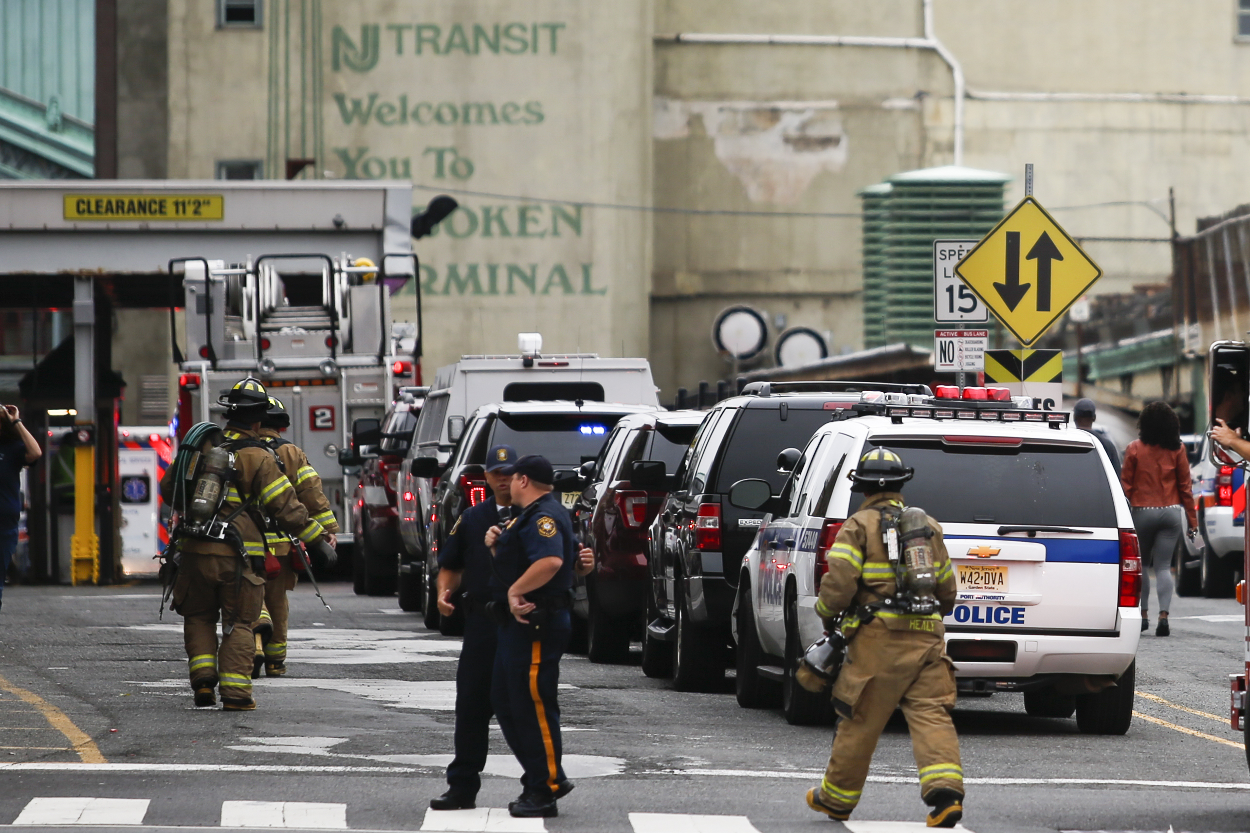 Police officers and firefighters arrive to the train terminal after a New Jersey Transit train crashed into the platform at Hoboken Terminal during morning rush hour