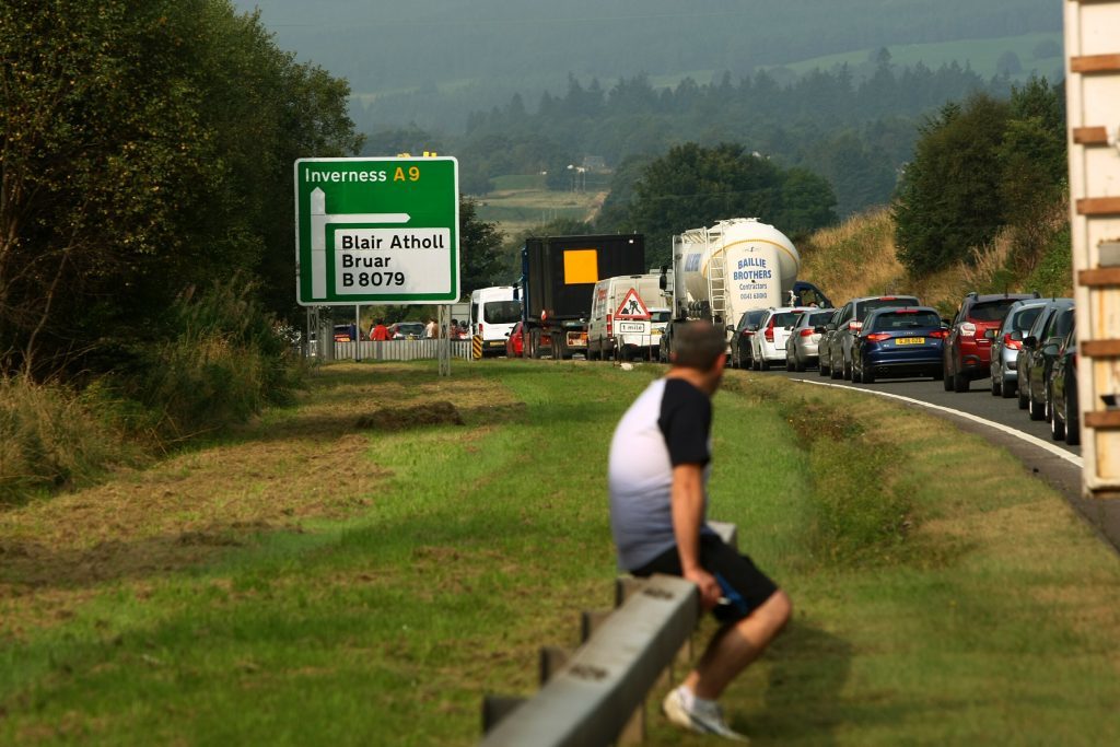 Drivers waiting to find out when the road will reopen.