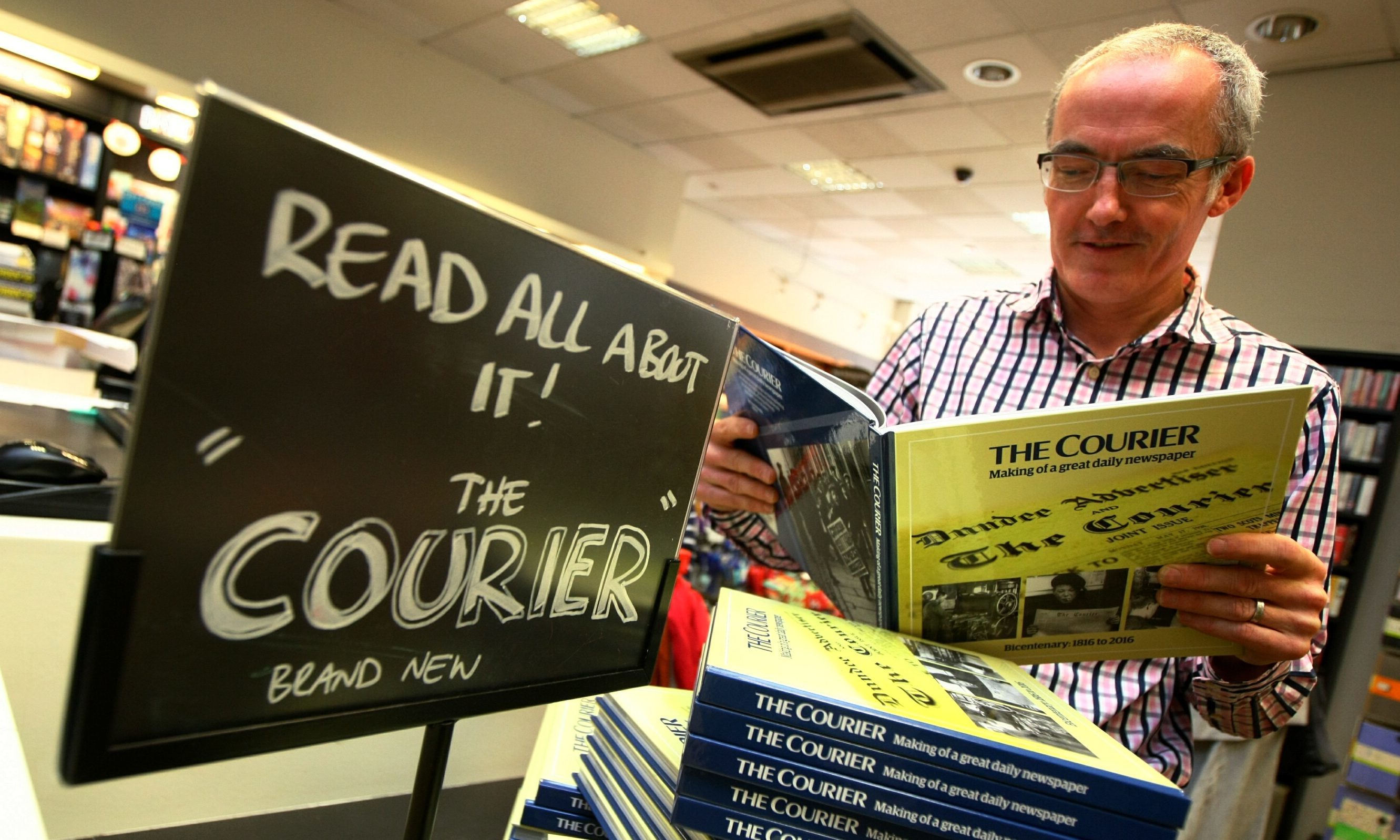 Waterstone's Dundee manager Kevin Breen with the new book on The Courier.