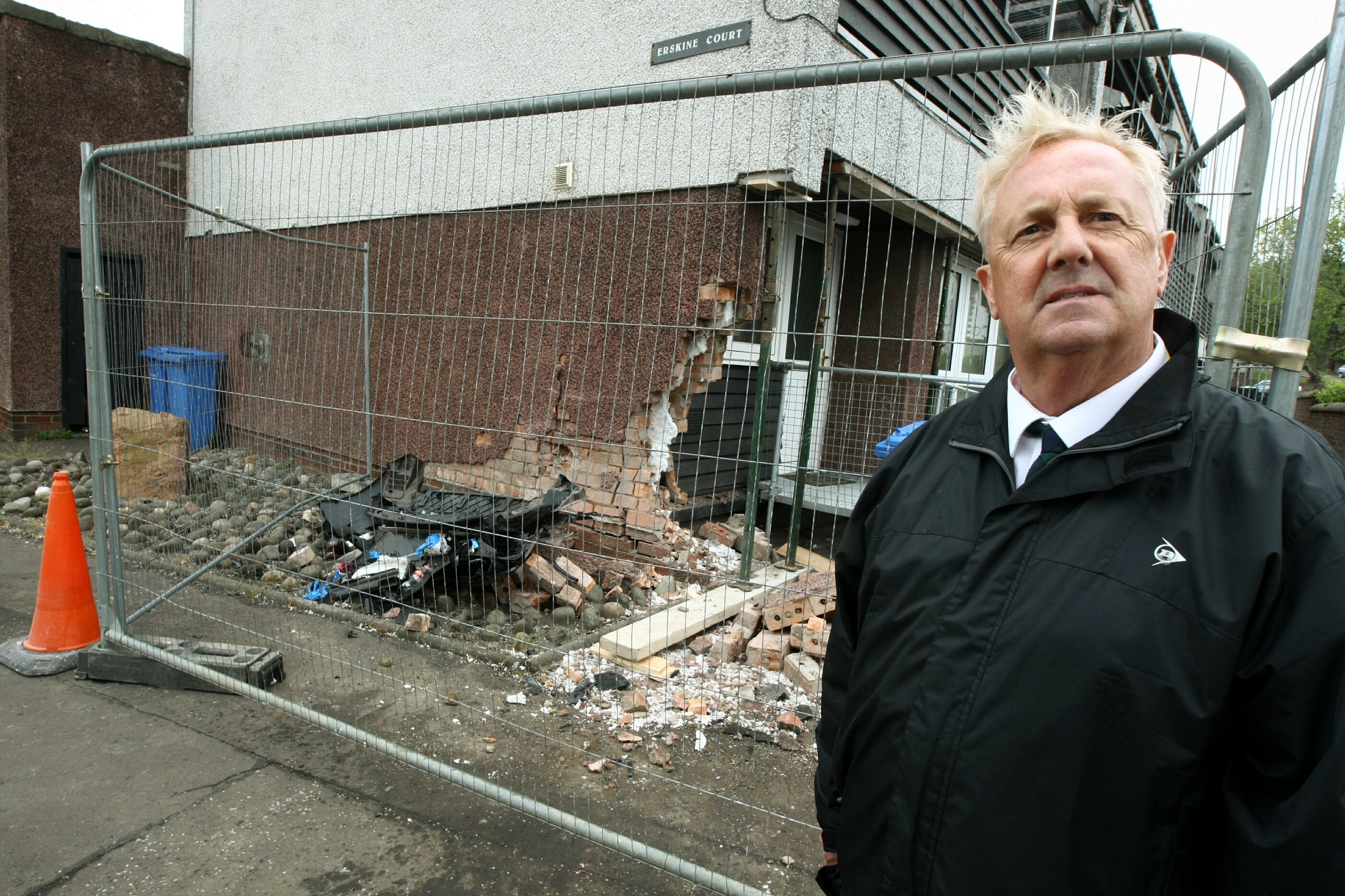 Councillor John O'Brien at the damaged flat