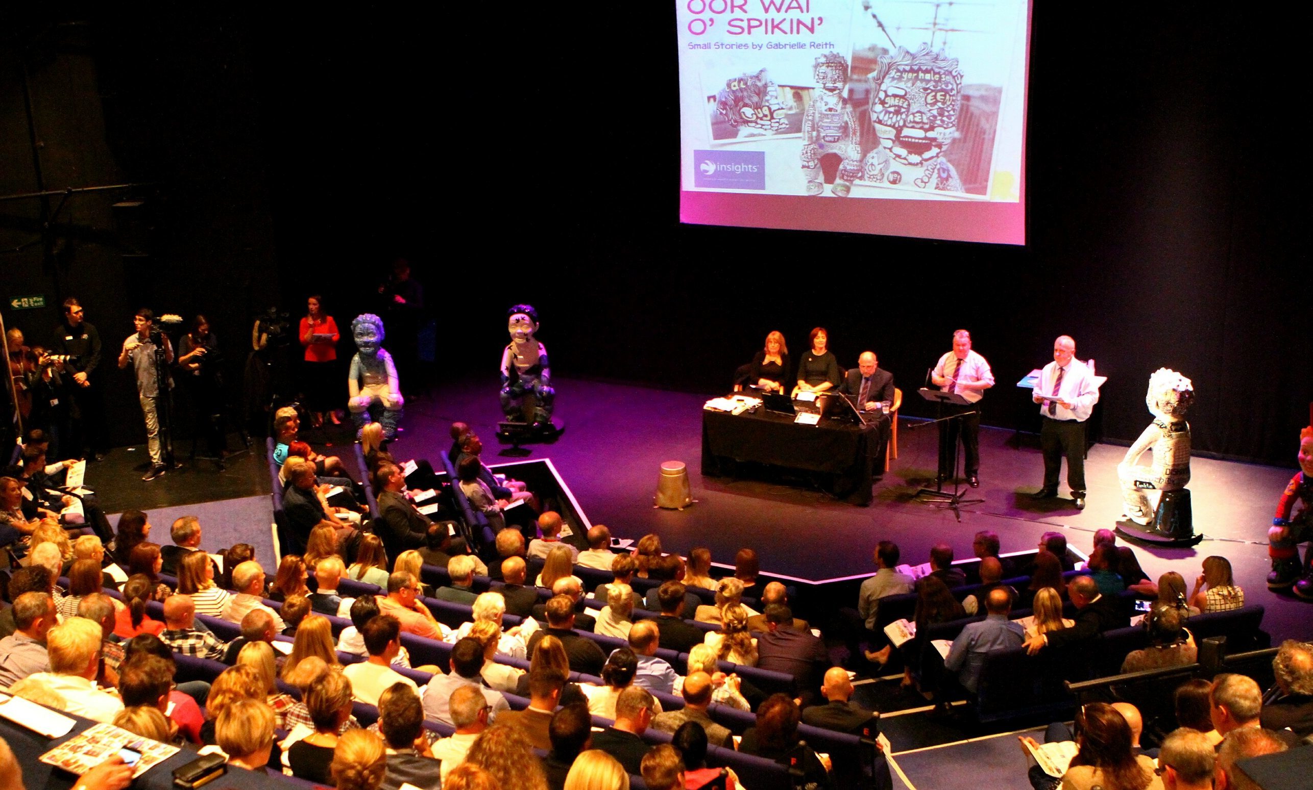 The auction under way in front of a capacity audience at Dundee Rep.