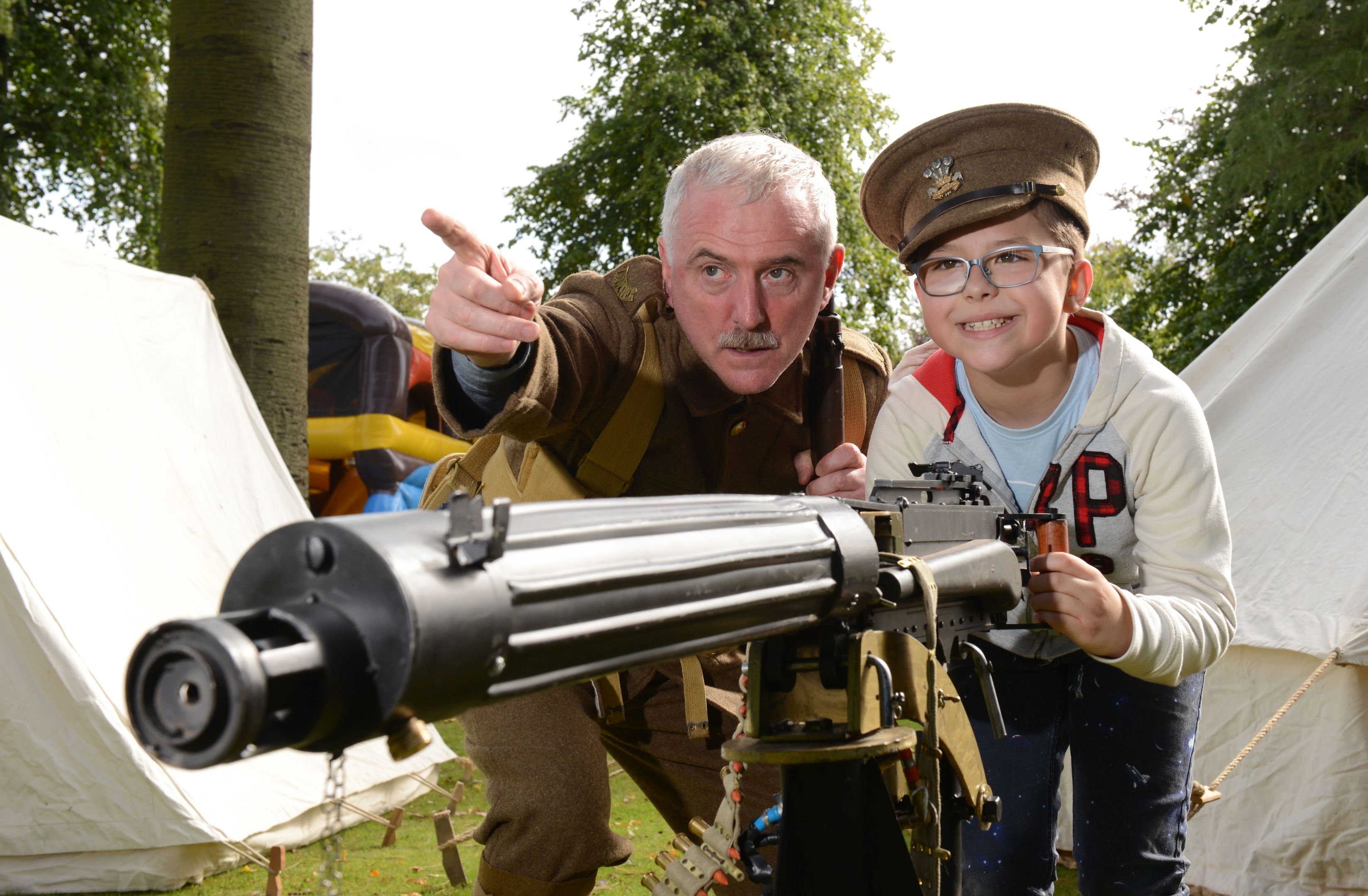 Prince of Wales Leinster Regiment's Ambrose Sharpe shows young recruit Michael Kwecka aged 8, the way to battle