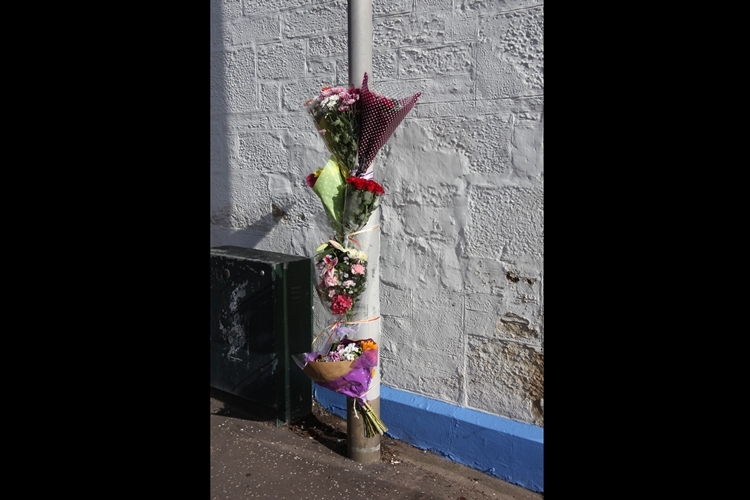 Floral tributes for Mrs Stormont at Keptie Street.