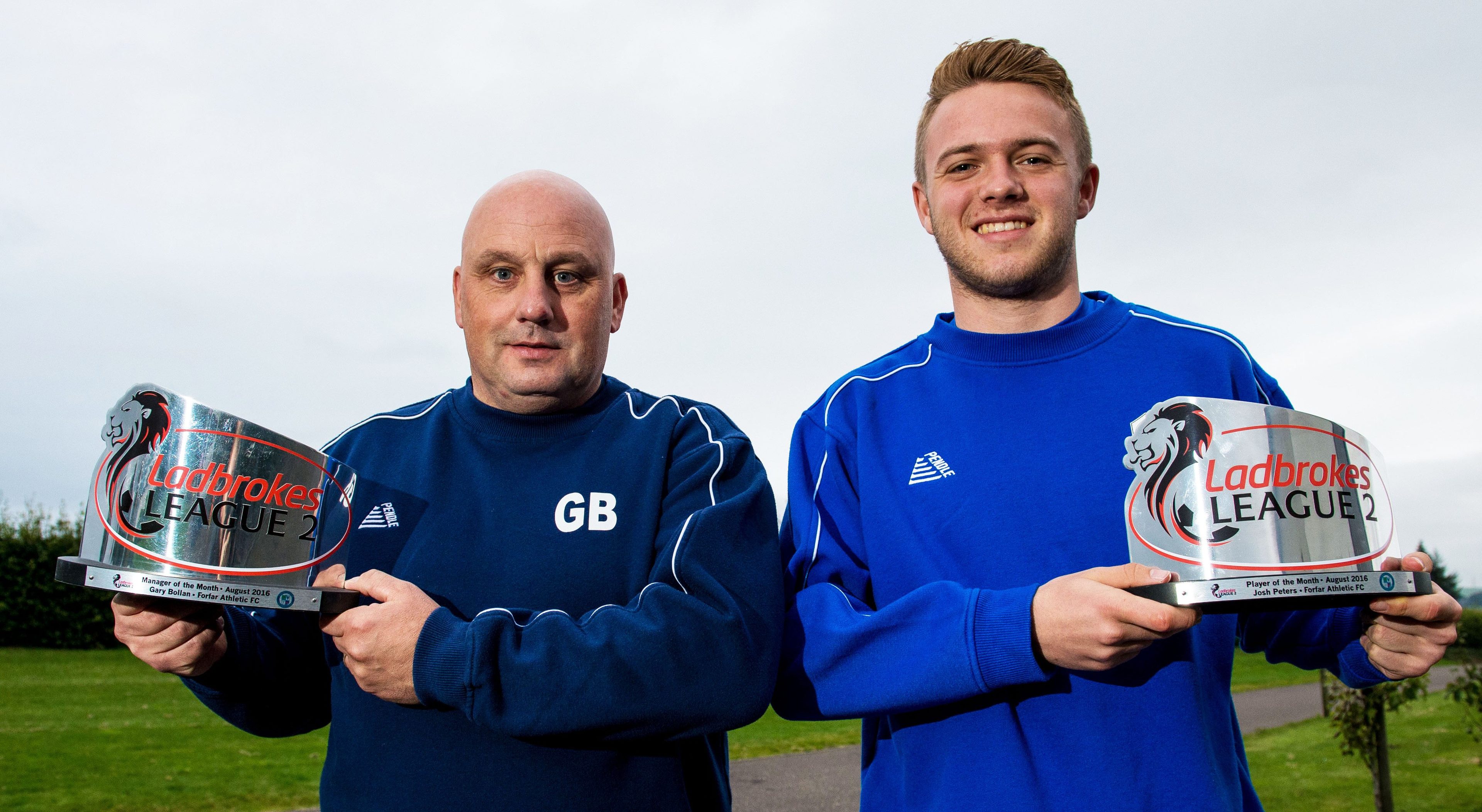 Gary Bolllan and Josh Peters with their awards.