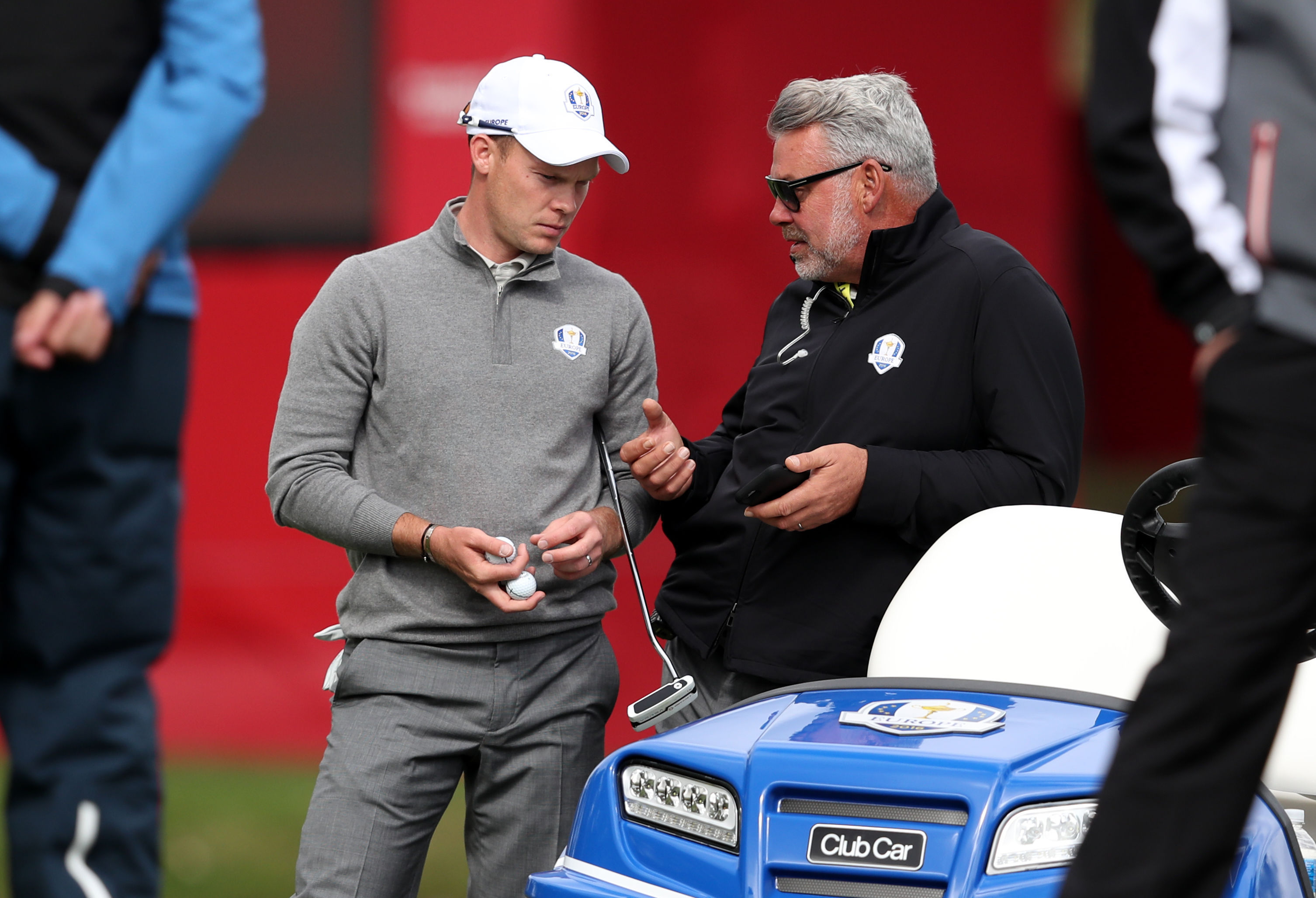 Europe's Danny Willett (left) chats with captain Darren Clarke (right) at Hazeltine.