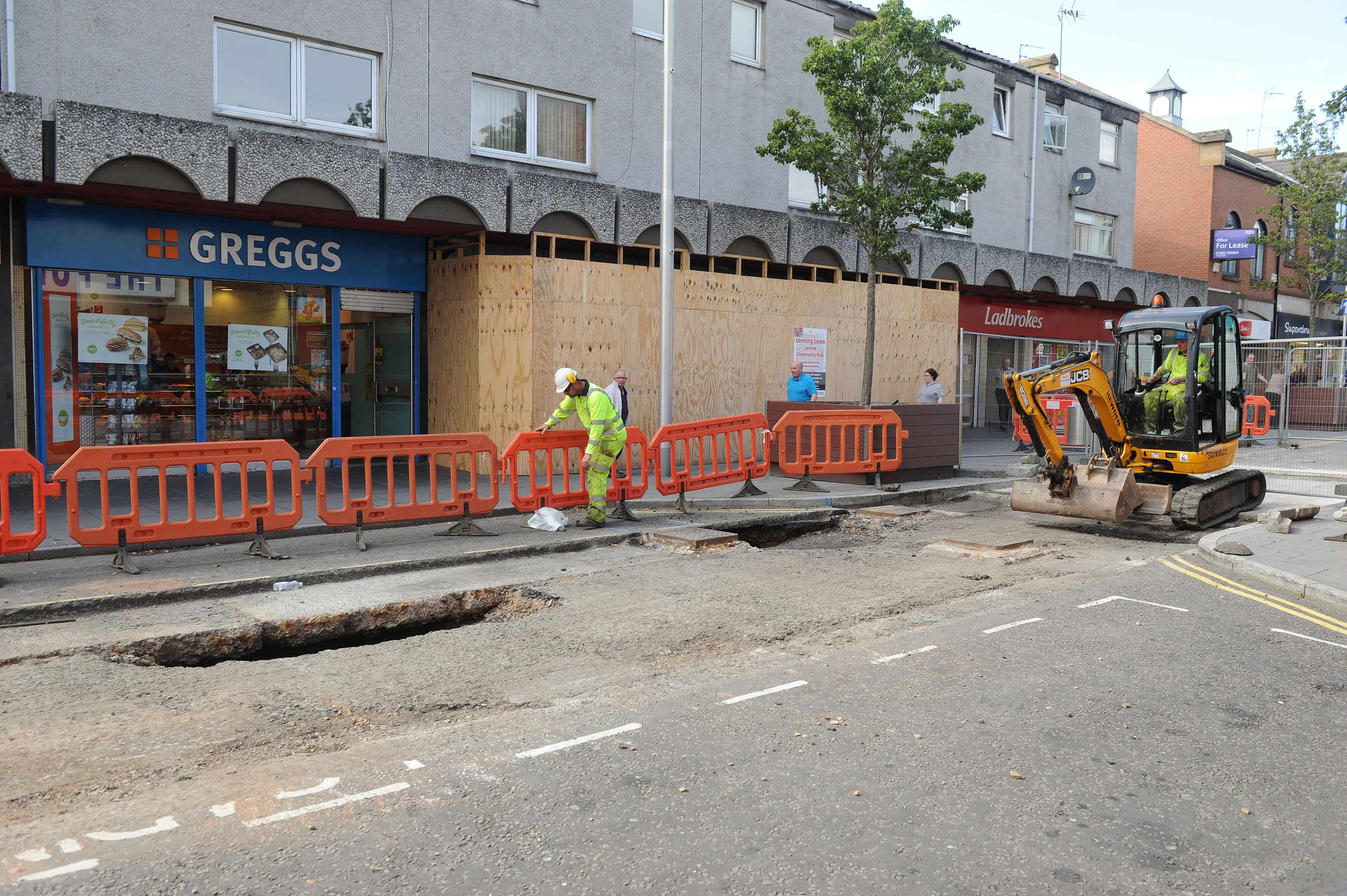 Contractors at work on Lochee High Street.