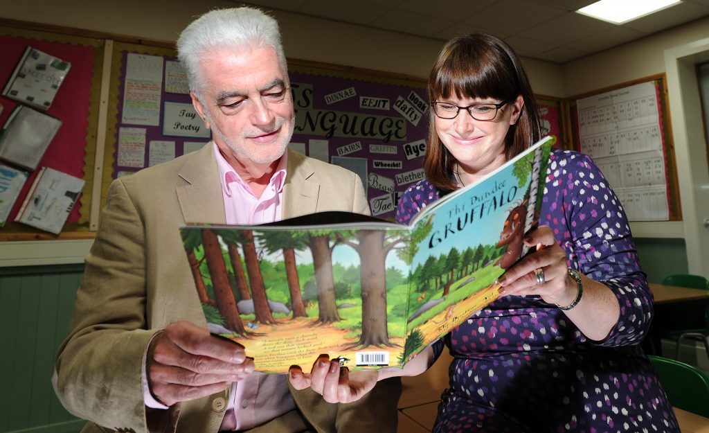 Billy Kay and Diane Anderson peruse the Dundee Gruffalo at Morgan Academy in 2016
