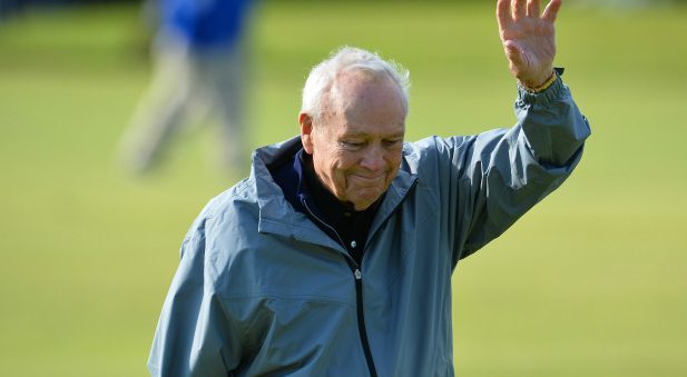 Winner of The Open in 1961 and 1962, Arnold Palmer waves to fans during the Champion Golfers' Challenge on The Old Course at St Andrews on July 15, 2015