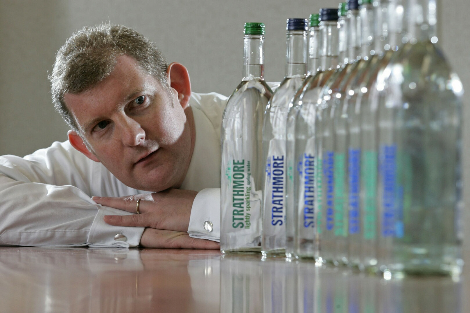 AG Barr CEO Roger White with a range of Strathmore water products
