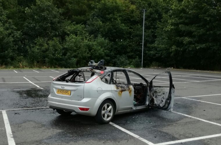 The burnt out car on Baker Road.