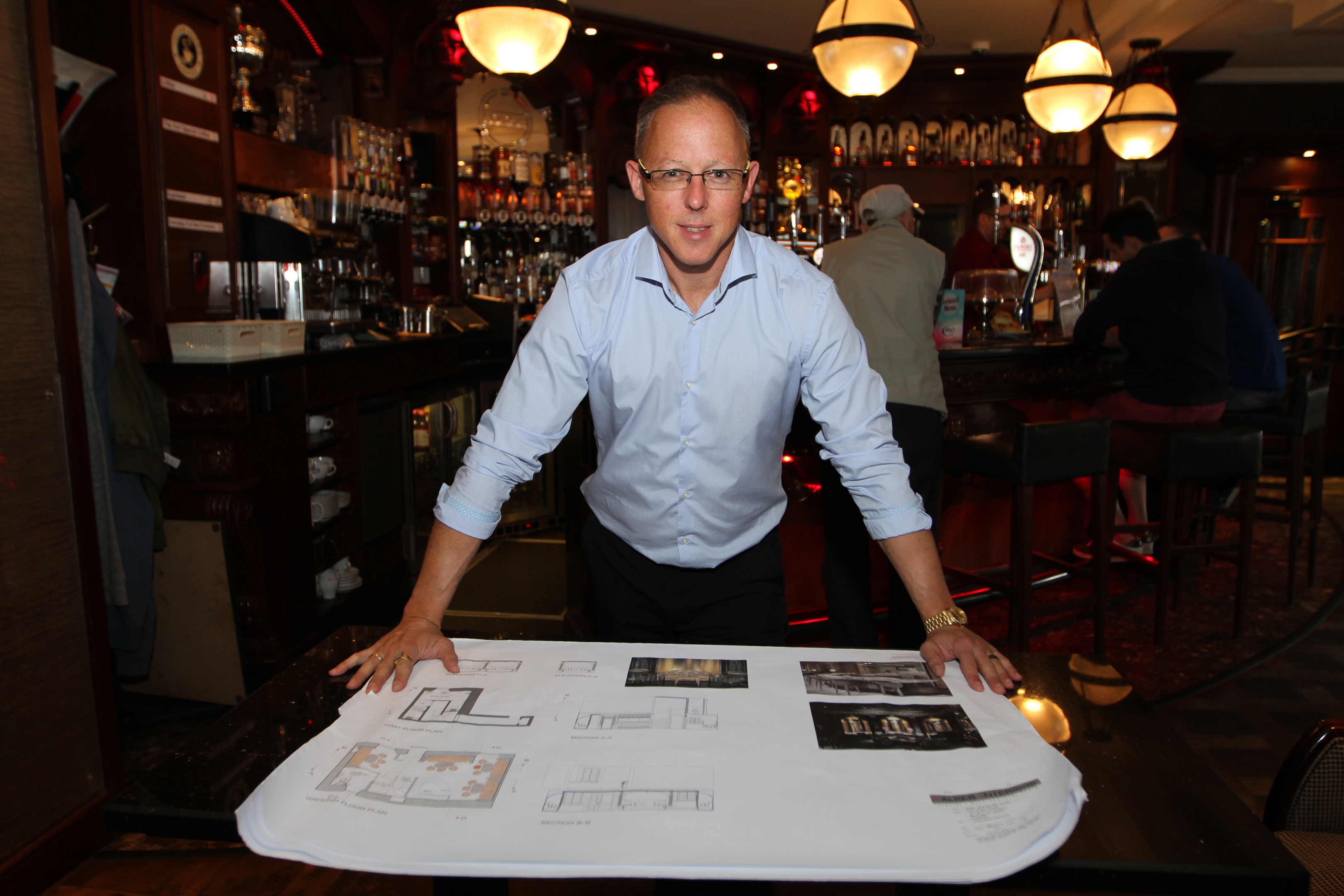 Owner John Black with plans for the new bar.