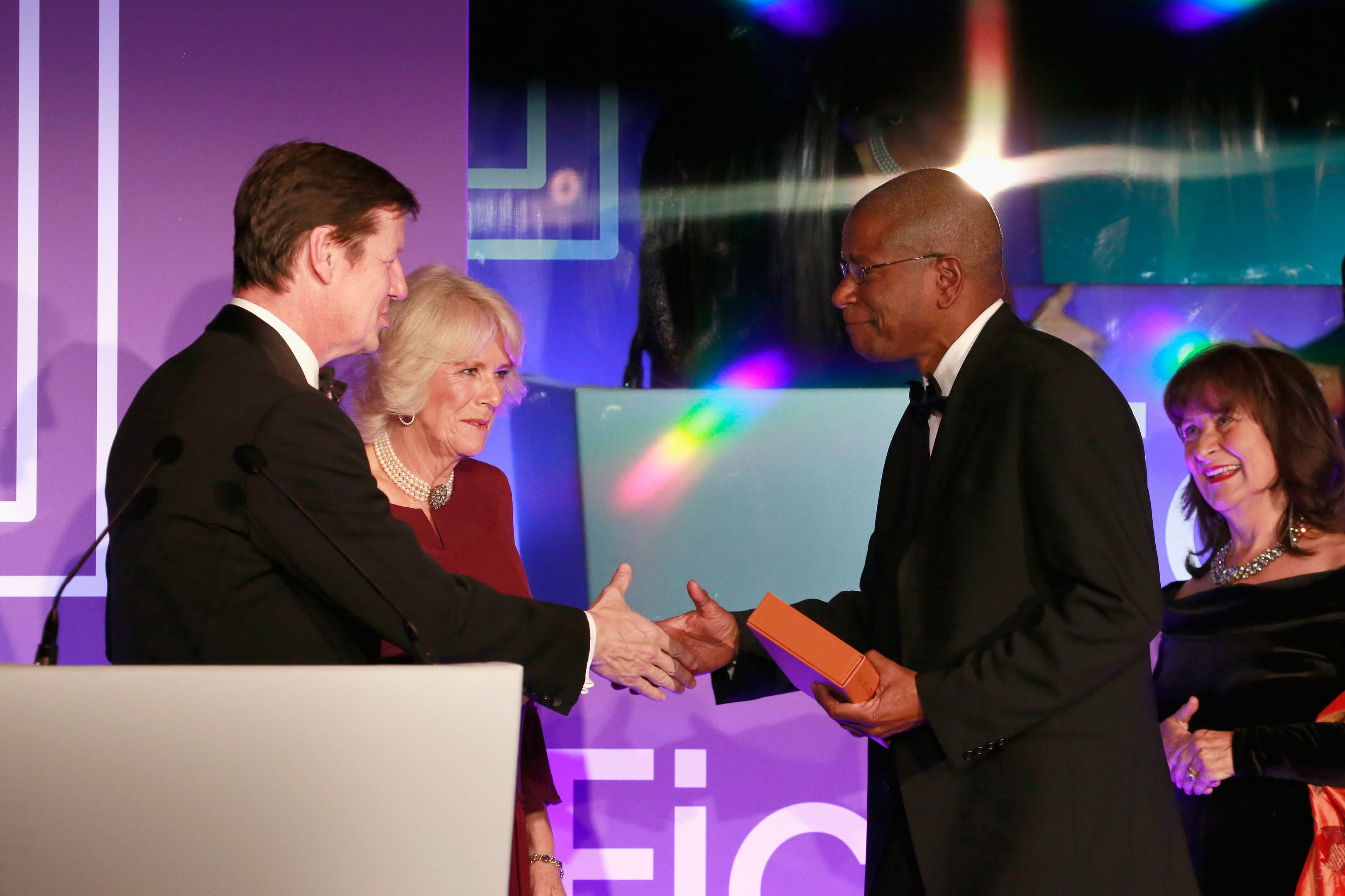 The Duchess of Cornwall presents Paul Beatty with a bound copy of his book.